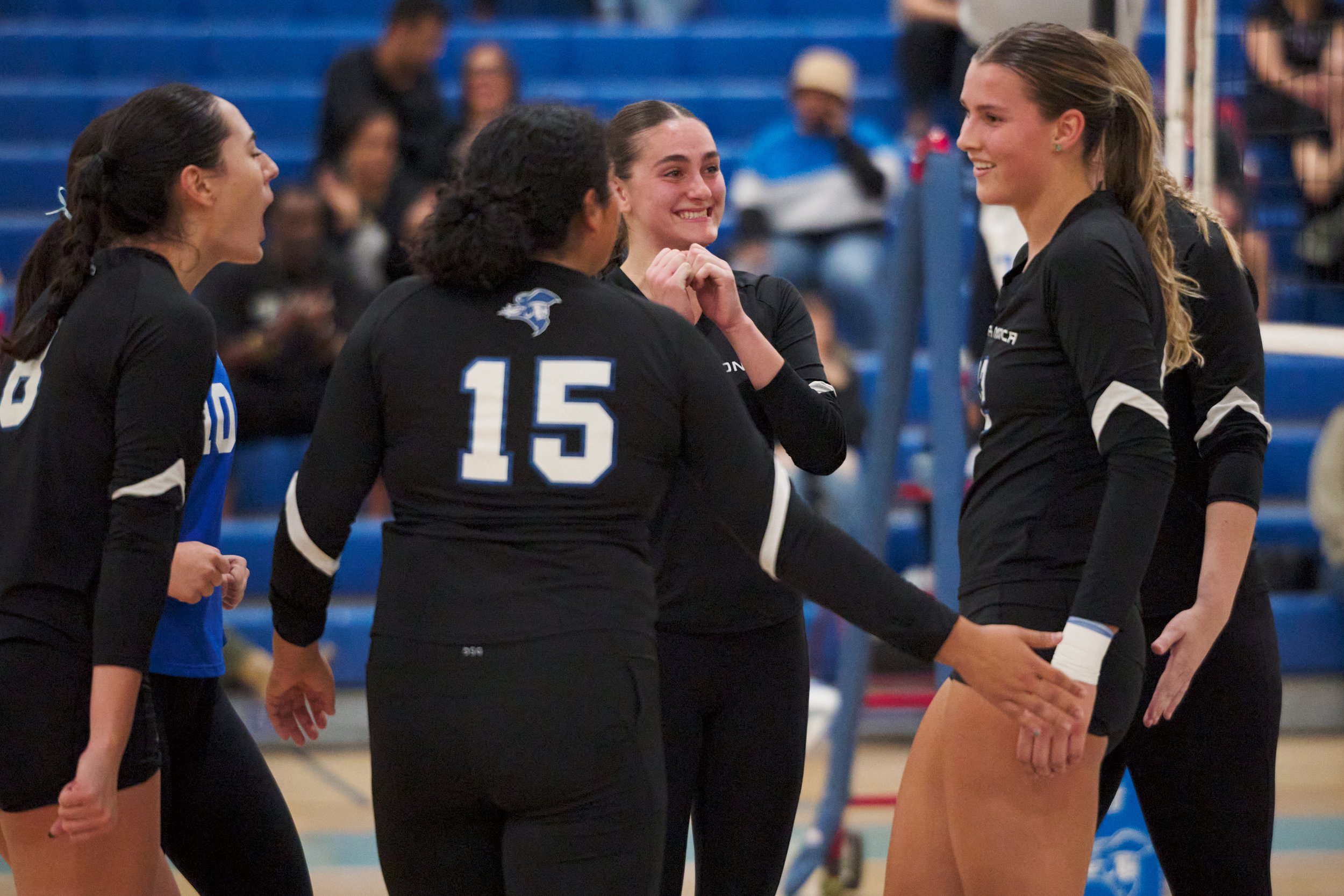  Santa Monica College Corsairs' Natalie Fernandez (8), Sophia Odle (10), Jaylynn Fierro (15), Prior Borick (center), Mia Paulson (right), and Mylah Niksa (far right) gather after Paulson scored a kill during the women's volleyball match against the B
