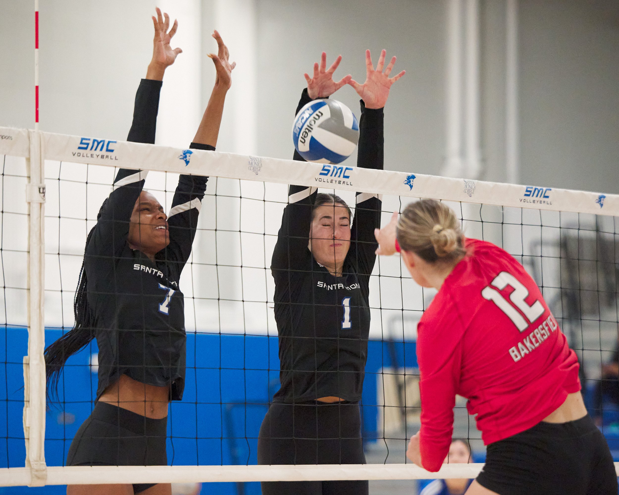  Santa Monica College Corsairs' Zarha Stanton and Maiella Riva block the ball from Bakersfield College Renegades' Alexandria Johnson during the women's volleyball match on Wednesday, Nov. 1, 2023, at Corsair Gym in Santa Monica, Calif. The Corsairs w