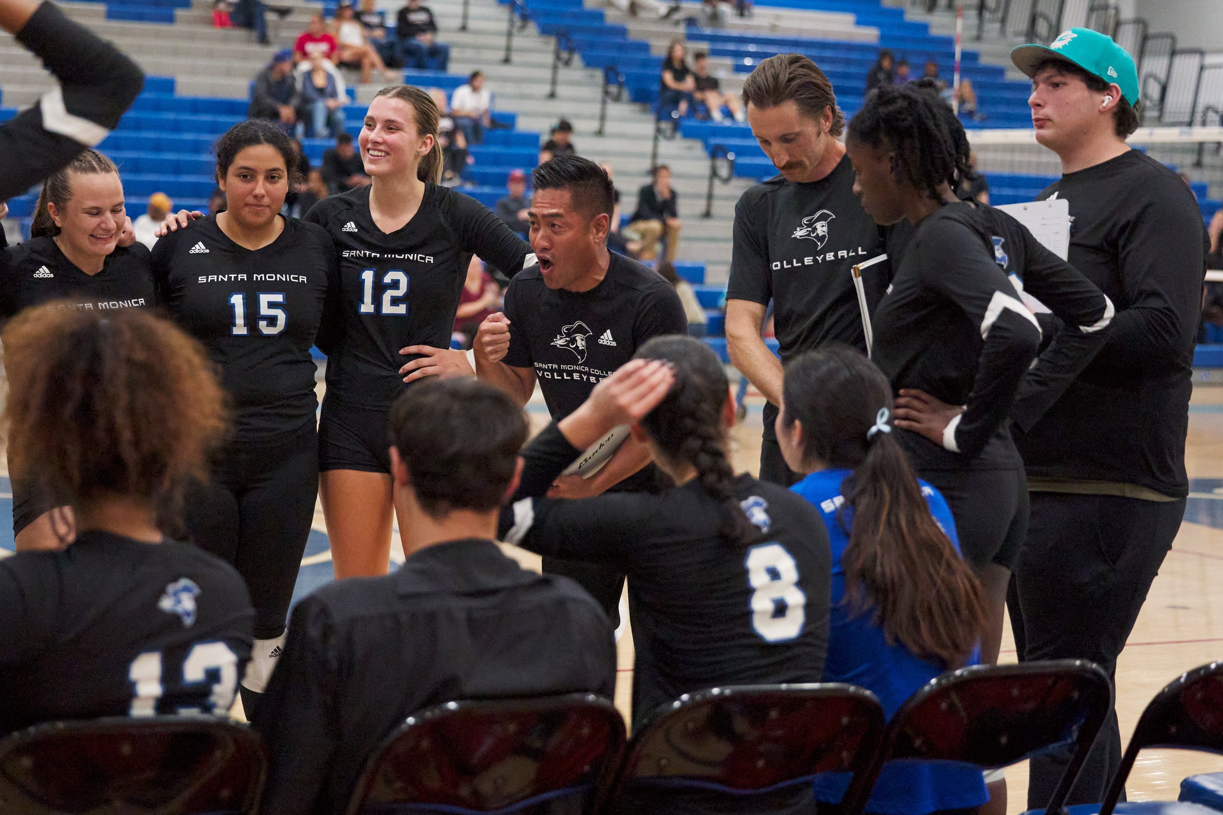  Santa Monica College Corsairs Women's Volleyball Head Coach Christian Cammayo (center) talks to the team during the match against the Bakersfield College Renegades on Wednesday, Nov. 1, 2023, at Corsair Gym in Santa Monica, Calif. The Corsairs won 3