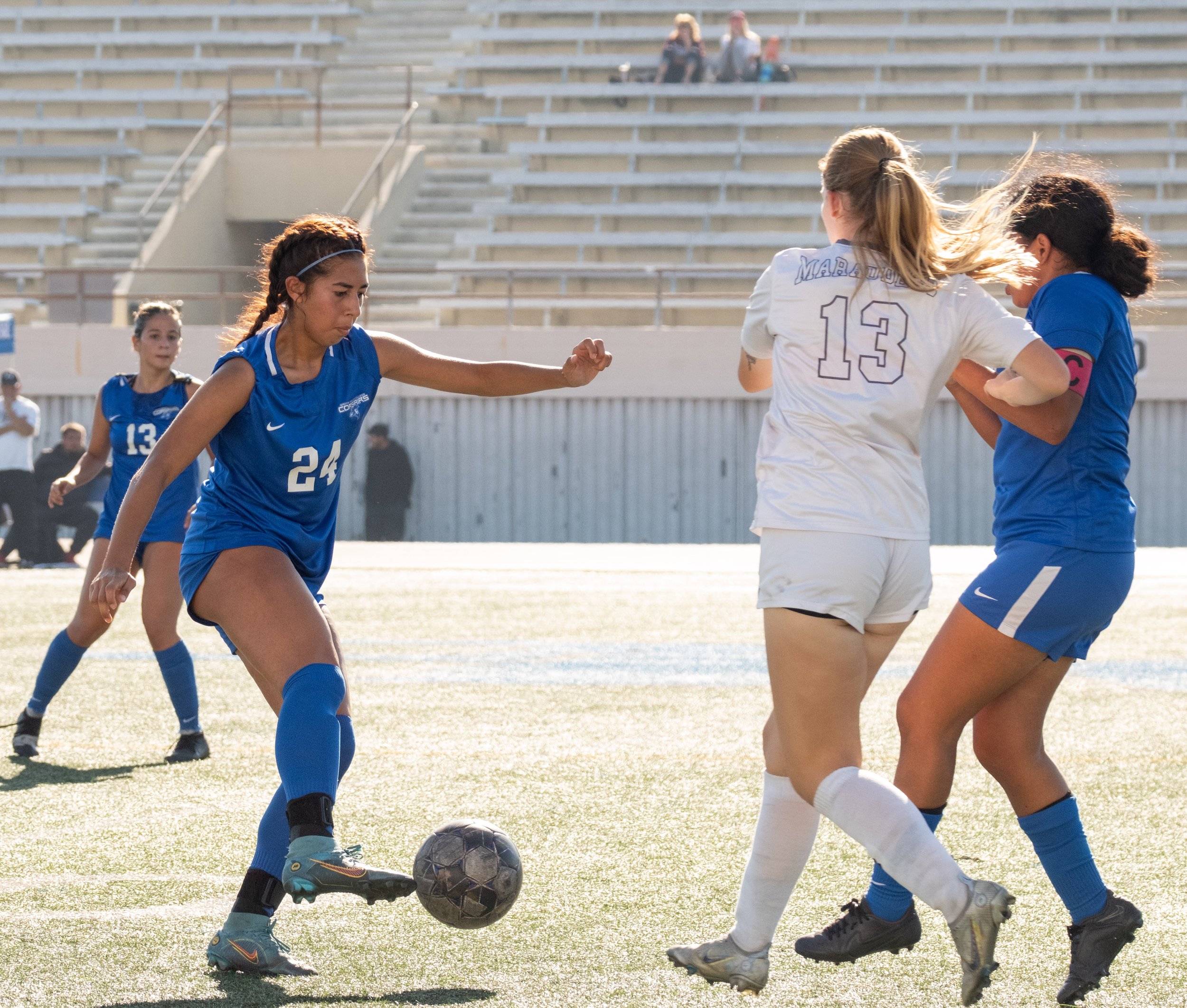  Santa Monica College women’s soccer center mid Andrea Ortiz(24) getting rid of the ball before Antelope Valley College forward Grace Crees(13) got to it during their match on Friday, Nov. 3 at Corsair Field in Santa Monica, Calif. (Danilo Perez | Th