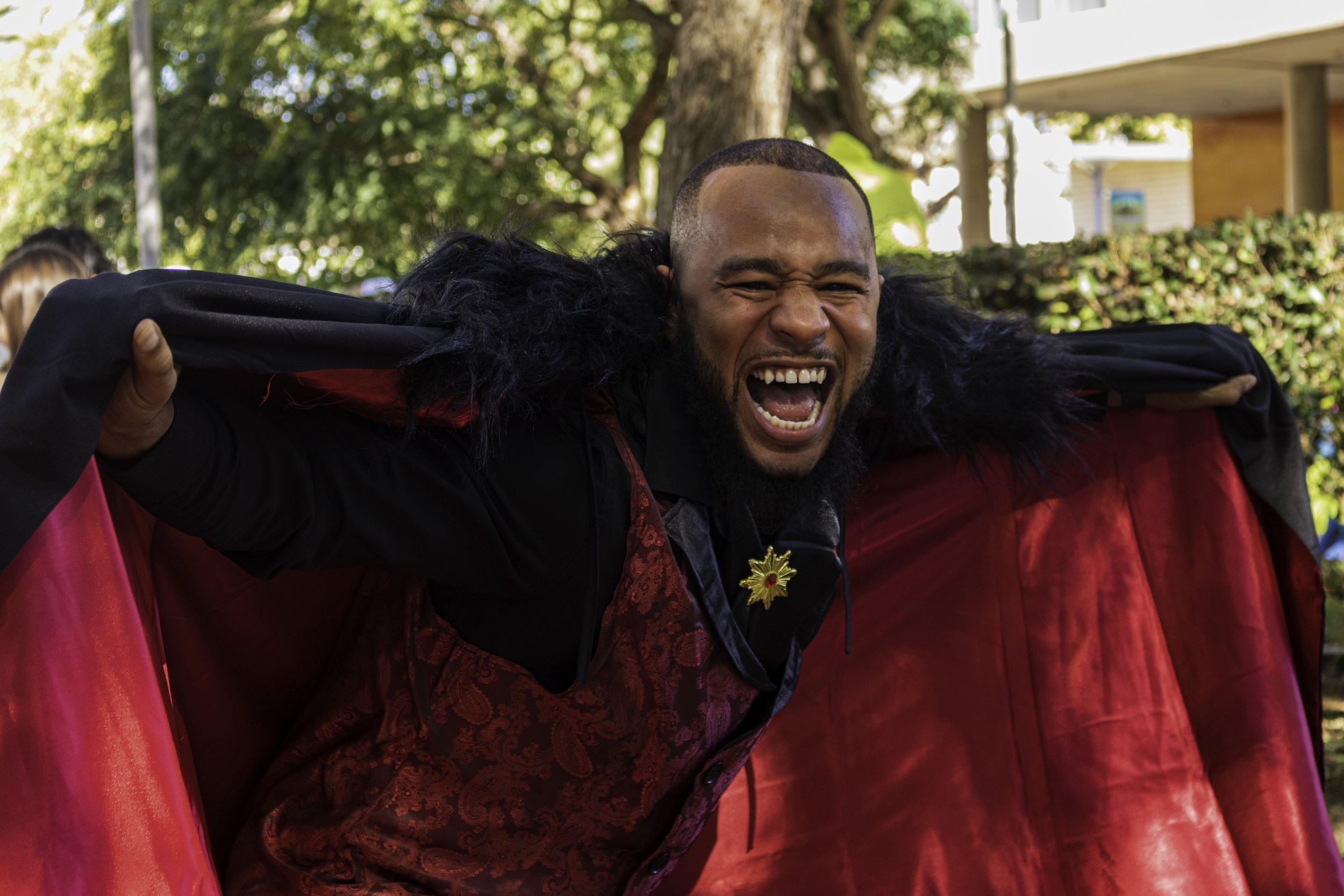  Santa Monica College, Arron Claaton poses with his vampire costume to the photographer during Club Row on Oct. 31, 2023 in Santa Monica, Cali. (Kevin Mendoza | The Corsair) 