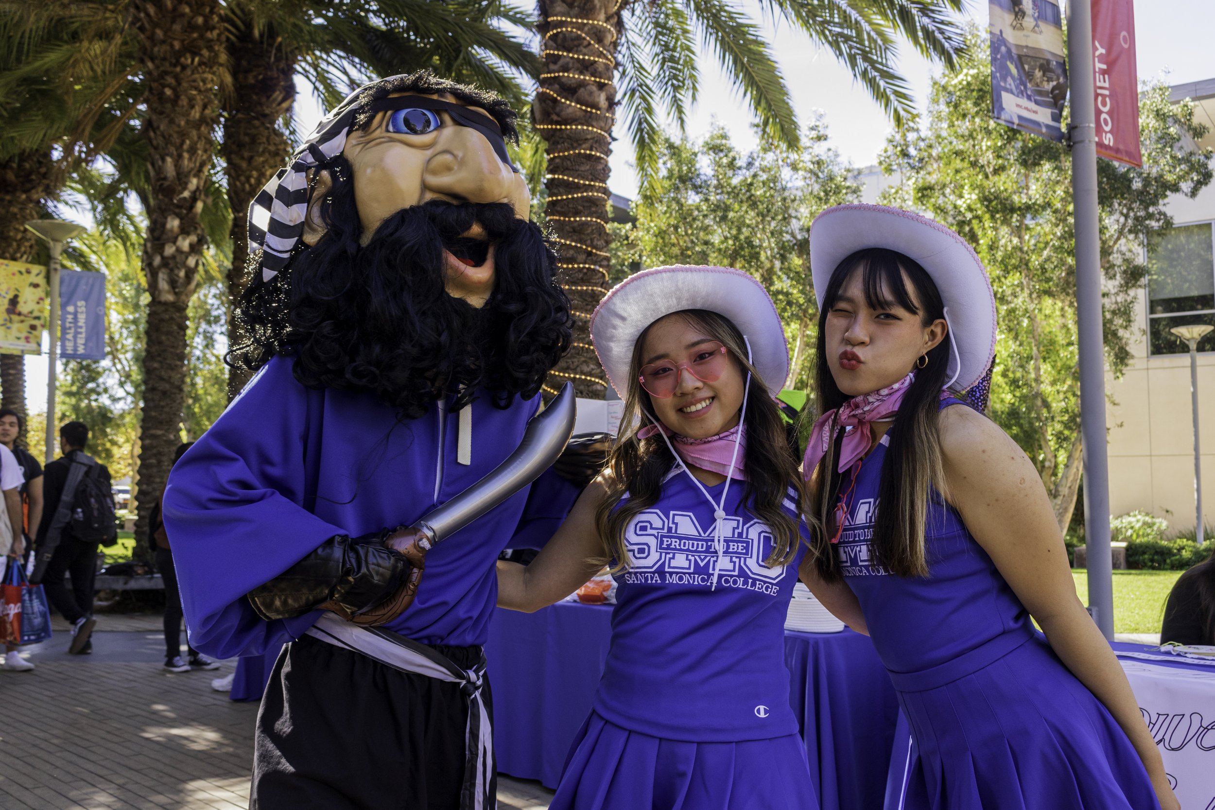  Santa Monica College, Pico the Pirate (Left) poses with the Corsair's Cheerleader Yu Ting Ho (Center) and Ching Yuan Hua (Right) during Club Row on Oct. 31, 2023 in Santa Monica, Cali. (Kevin Mendoza | The Corsair) 