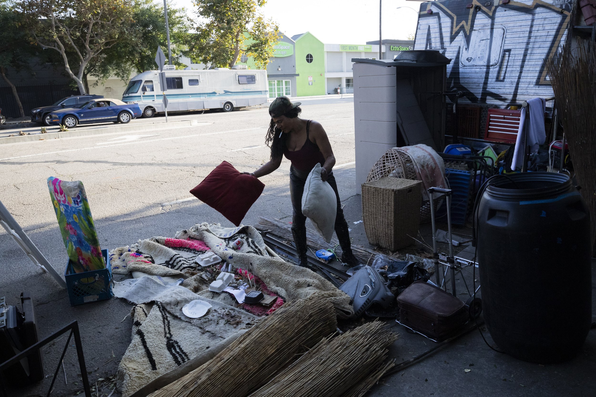  Rebecca Dannenbaum cleaning the street around the RV she lives in on Venice Blvd. in Los Angeles, Calif., on Oct. 24, 2023. She wants to avoid having her vehicle towed, so she is cleaning the street so sanitation doesn’t have to with the hopes that 