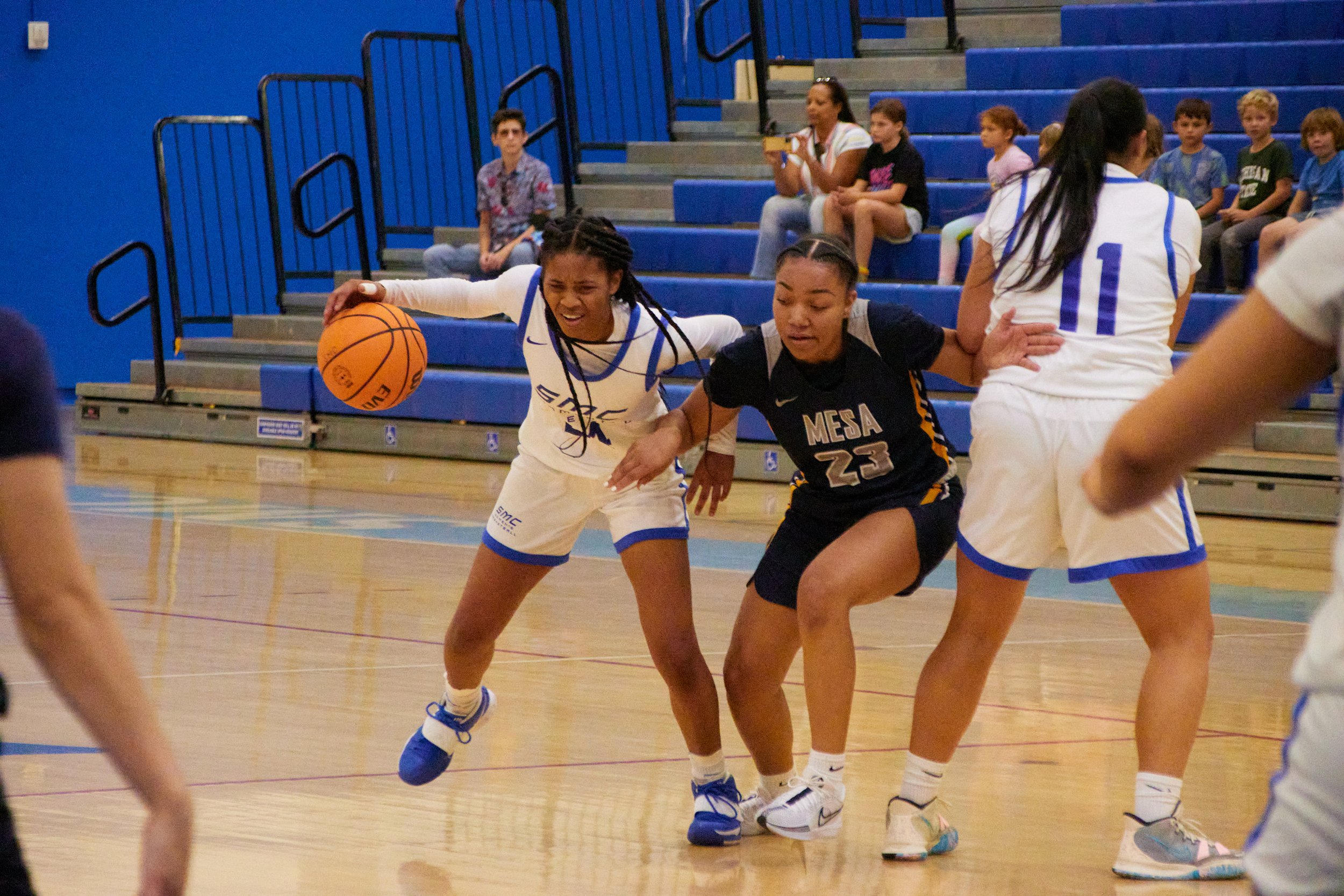  Santa Monica College Corsairs Guard Maya Stokes (left) and San Diego Mesa College Olympians Guard  Alivia Gillespie (right) during the match against each other at Corsair Gym, Santa Monica, Calif., on Nov. 9, 2023. The Corsairs won 47-43. (Danniel S
