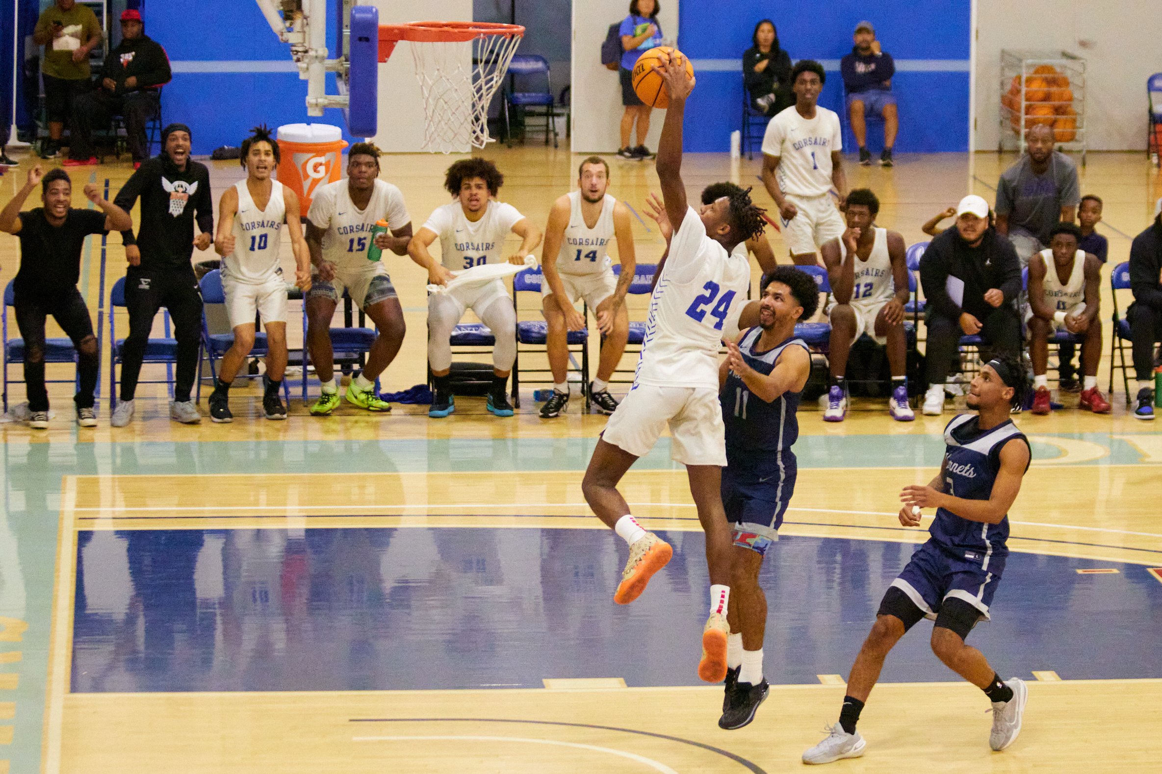  Santa Monica College Corsairs Point Guard Mike Hill performing a slam dunk after running across the field during the men's basketball match against Fullerton College Hornets at Corsair Gym, Santa Monica, Calif., on Oct 24, 2023. The Corsairs lost 76