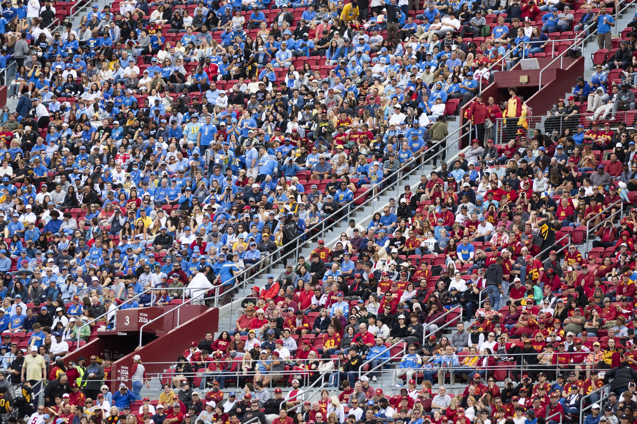  The crowd watching a football game between University of California, Los Angeles (UCLA) Bruins and University of Southern California (USC) Trojans at the Los Angeles Memorial Coliseum, in Los Angeles, Calif., on Saturday, Nov. 18, 2023. The Bruins w