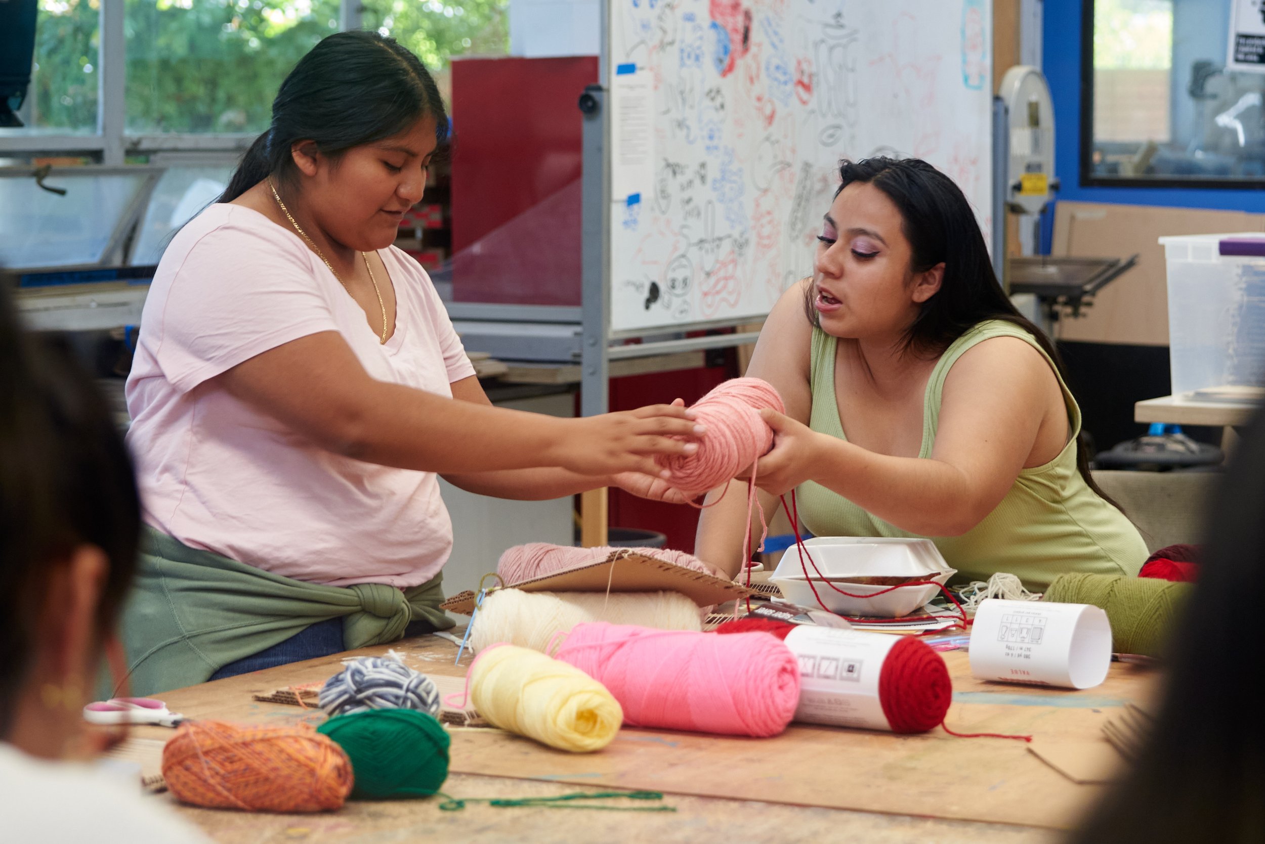  Stefani Hernandez and A. Juarez handle yarn during a weaving workshop conducted by weaver and textile artist Porfirio Gutierrez on Thursday, Oct. 12, 2023, at Santa Monica College in Santa Monica, Calif. (Nicholas McCall | The Corsair) 