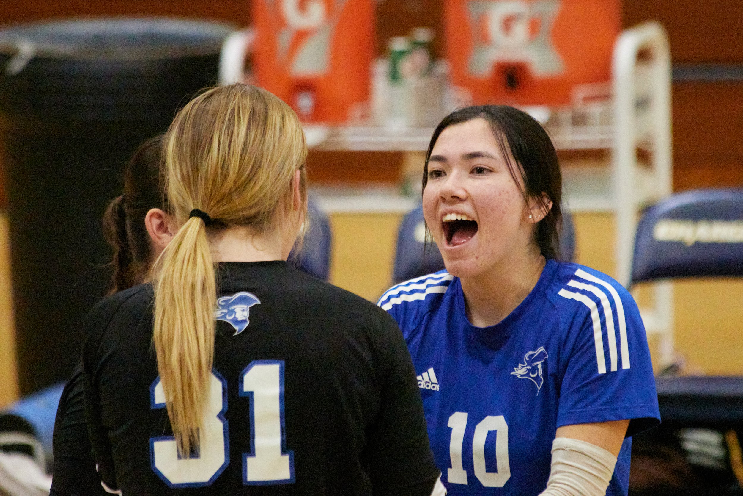  Santa Monica College Corsairs setter Sophia Odle (right) with middle blocker Mylah Niksa (front) and outside hitter Nataliie Fernandez (back) during the women's volleyball match against Cypress College Chargers at Cypress College Gymnasium number 2,