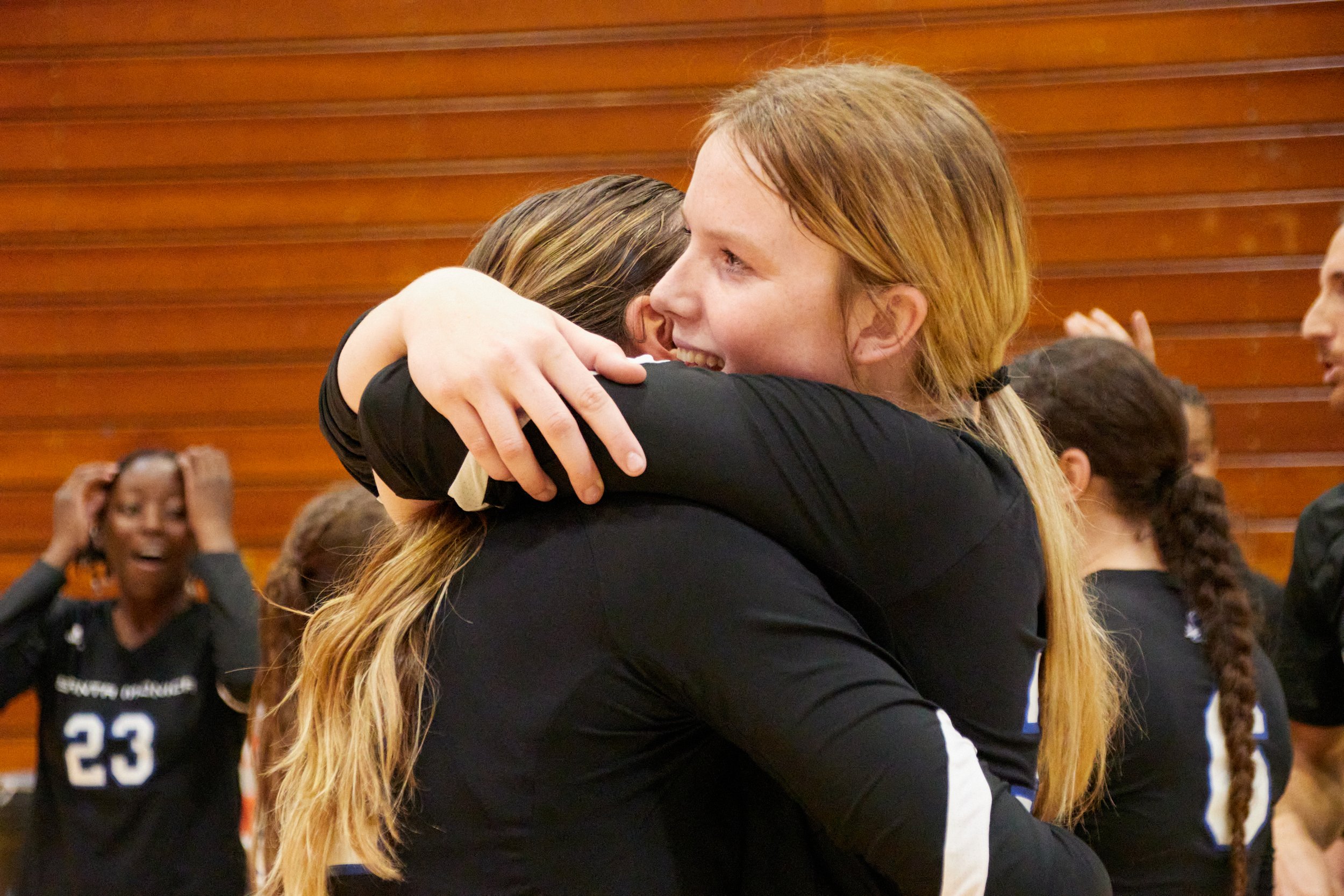 Santa Monica College Corsairs middle blocker  Mylah Niksa (right) hugging with setter Mia Paulson (left) right after they won the women's volleyball match against Cypress College Chargers at Cypress College Gymnasium number 2, Cypress, Calif., on No