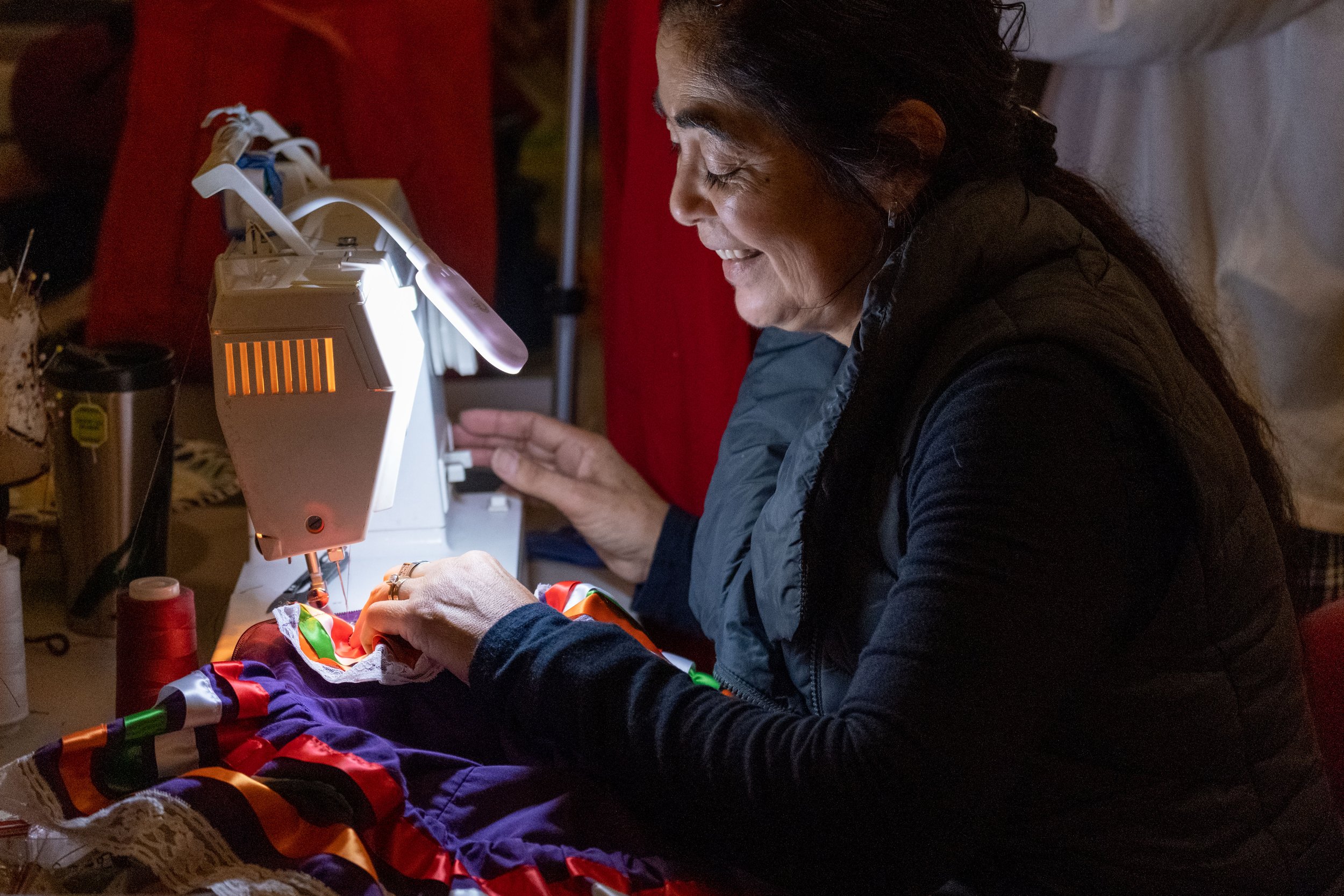  Backstage at BroadStage, professional costumer Patricia Oliva makes last minute costume adjustments before the dress rehearsal of Global Motion in Santa Monica, Calif. on Wednesday, Nov. 15, 2023. (Akemi Rico | The Corsair) 