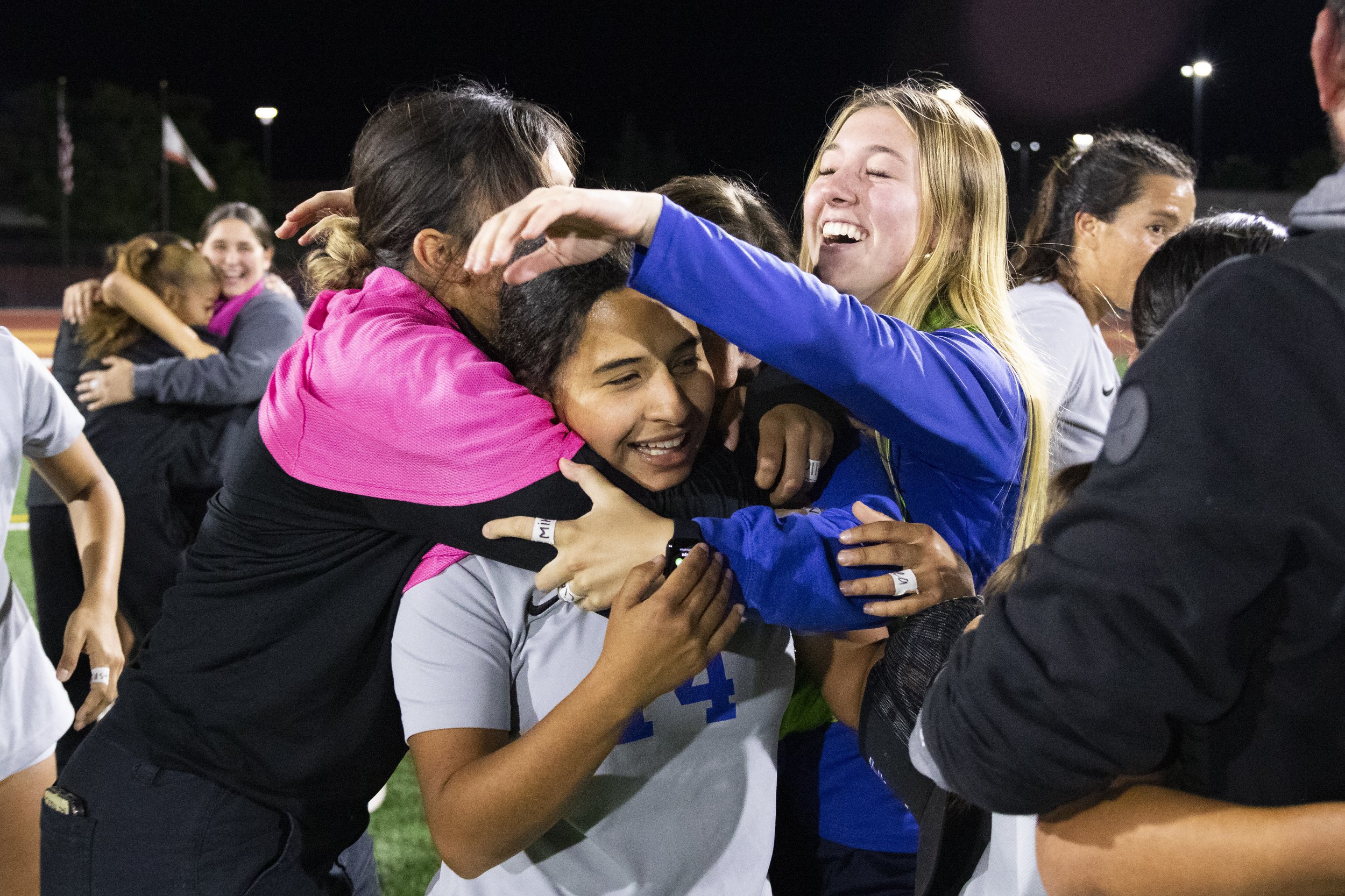  Santa Monica College Corsair midfielder Vashti Zuniga (center) being embraced by her team after they defeated the Saddleback College Bobcats, their first defeat of the season, at Saddleback College in Mission Viejo, Calif., on Tuesday, Nov. 21, 2023