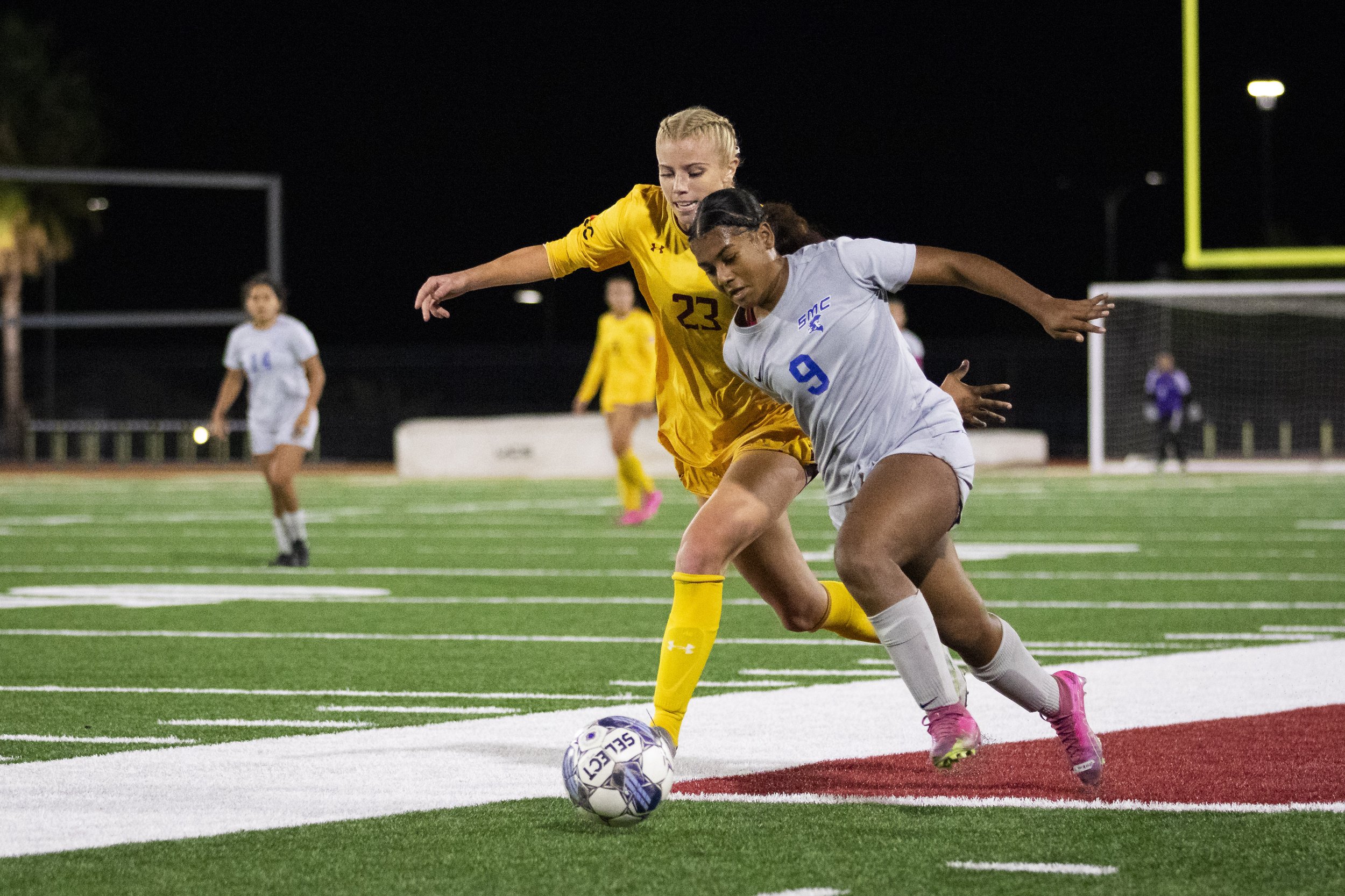  Santa Monica College Corsair forward Amarah Martinez (right) attacks while Saddleback College Bobcat’s defense Summer Hackett (left) attempts to take control of the ball in the second half of a soccer game at Saddleback College in Mission Viejo, Cal