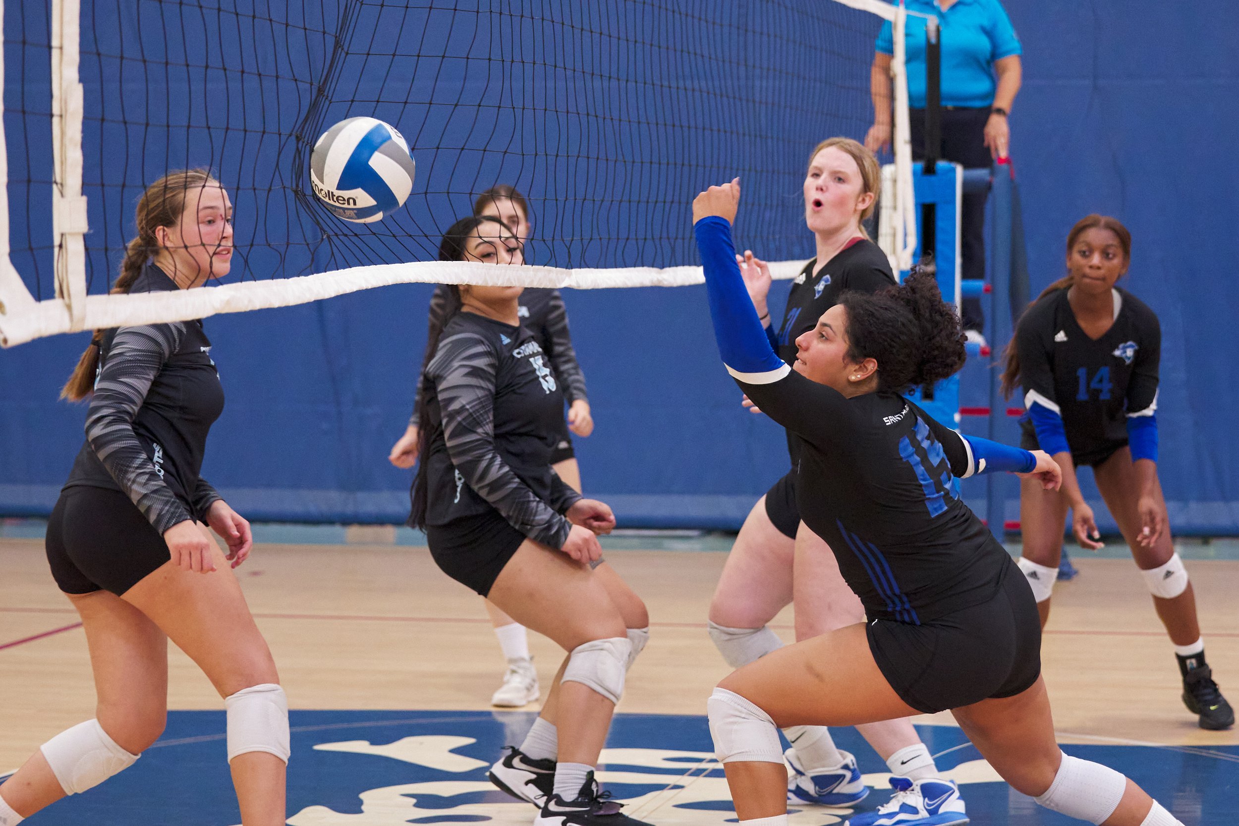  Santa Monica College Corsairs' Jaylynn Fierro (bottom right) saves the ball, only to send it into the net, during the women's volleyball match against the Cuyamaca College Coyotes on Wednesday, Sept. 6, 2023, at the SMC Gym in Santa Monica, Calif. T