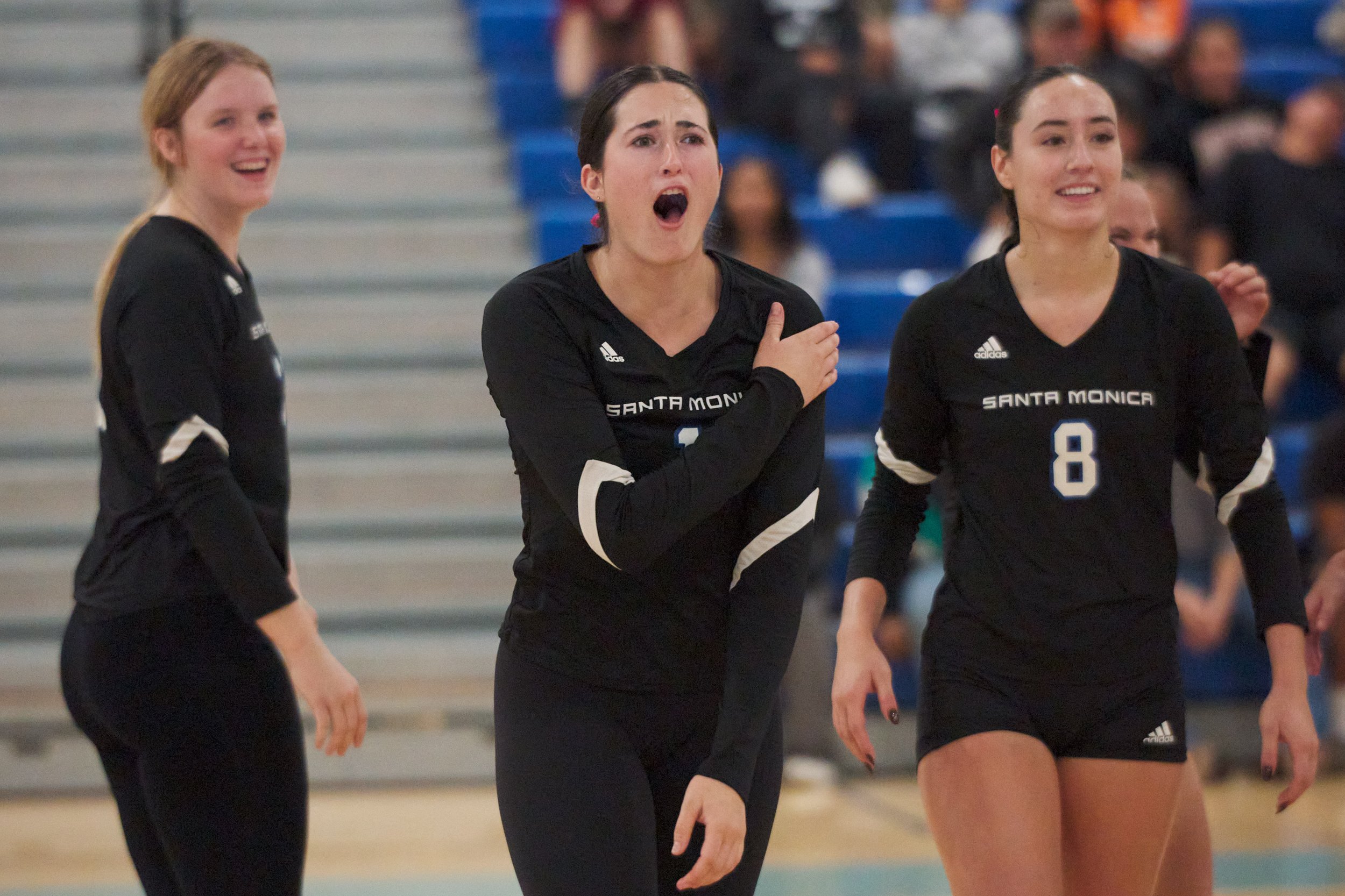  Santa Monica College Corsairs' Maiella Riva (center), in between Mylah Niksa (left) and Natalie Fernandez (right), touches her shoulder and is fine after pivoting a heels-over-head tumble on it during the women's volleyball match against the Citrus 