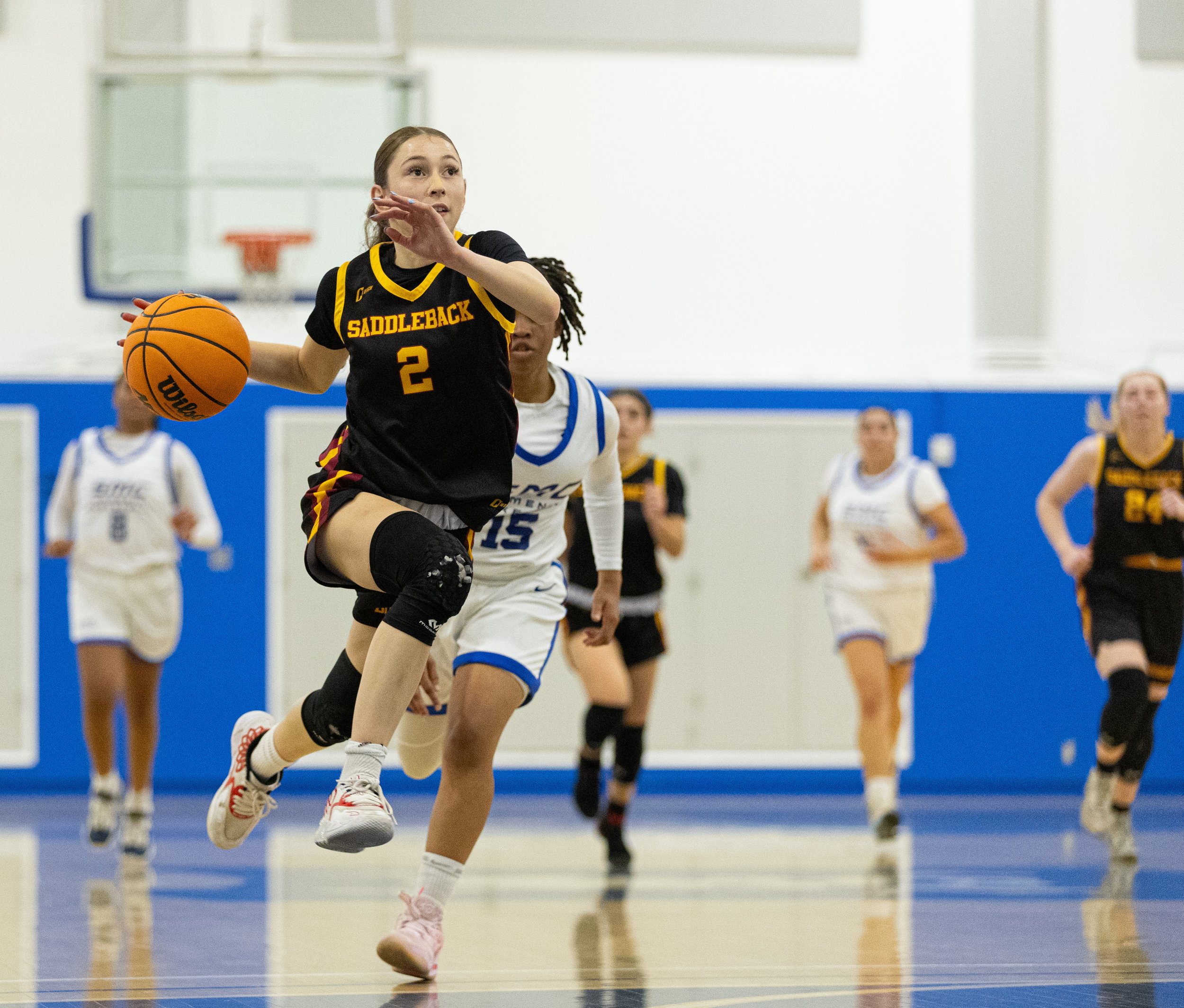  Bobcat guard Aleksia Gadea(2) from Saddleback College getting passed Santa Monica College(SMC) Corsair Jaiyahne Henderson(15) to get a layup in the SMC Pavillion Gym at Santa Monica, Calif. Corsairs lost 62-50 to put them in a 3-game losing streak o