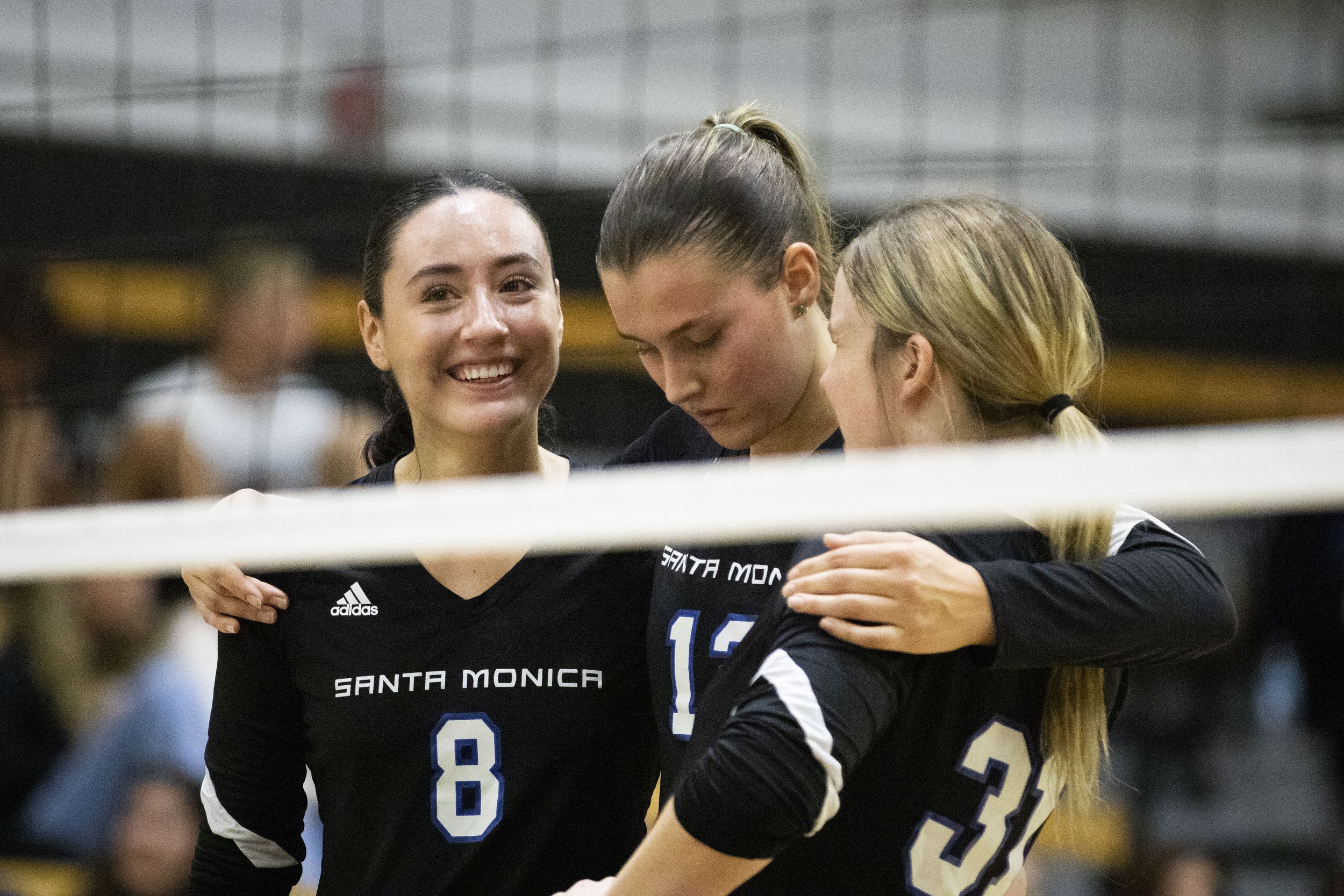  Santa Monica College Corsairs outside hitter Natalie Fernandez, setter Mia Paulson, and middle blocker Mylah Niksa take a moment to hype each other up after a timeout  during the Volleyball SoCal Regional Final against the Ventura College  Pirates a