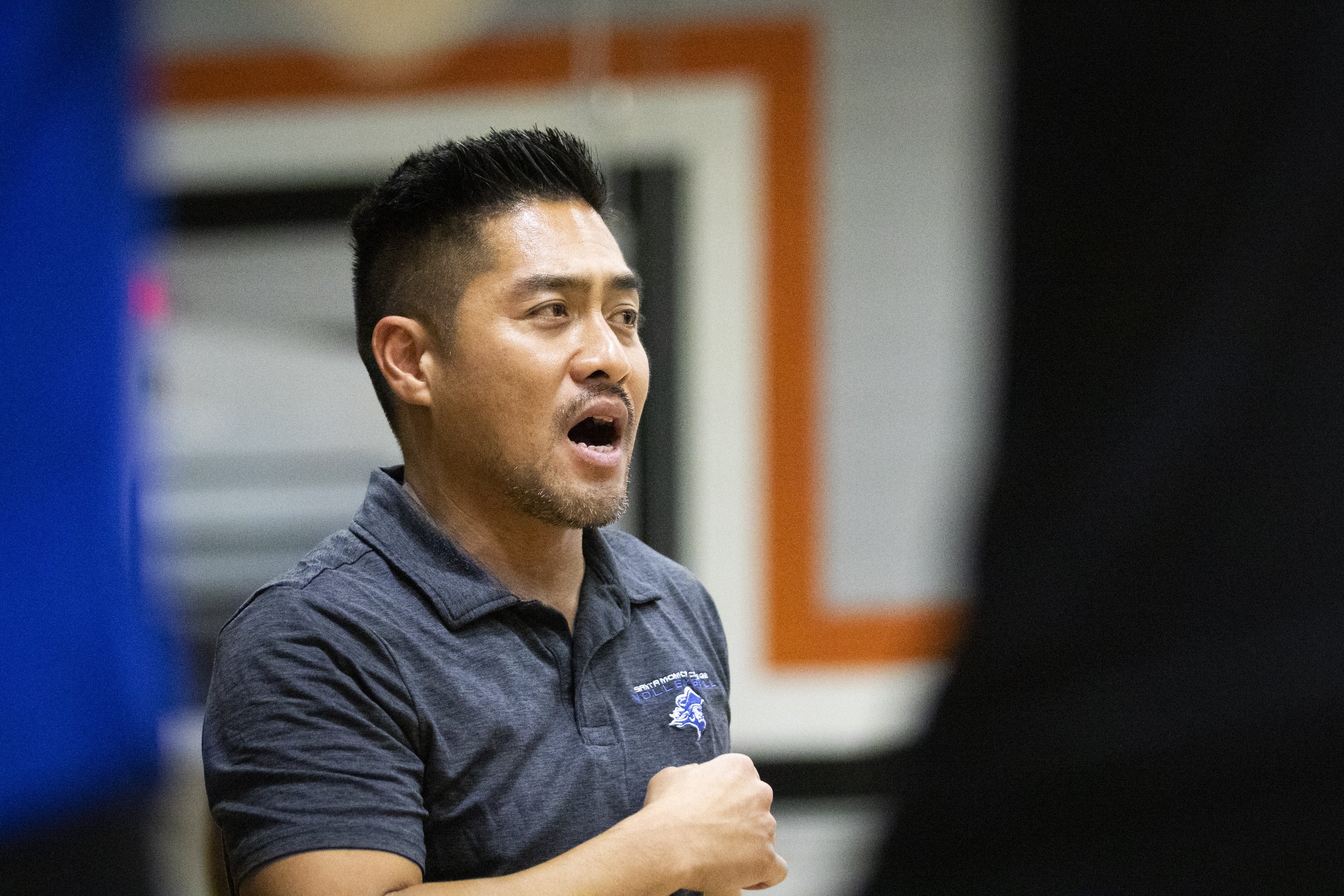  Santa Monica College women’s volleyball head coach Christian Cammayo talks to the Corsairs during a timeout during the SoCal Regional Final against the Ventura College  Pirates at Ventura College in Ventura, Calif., on Saturday, Nov. 25, 2023. The C