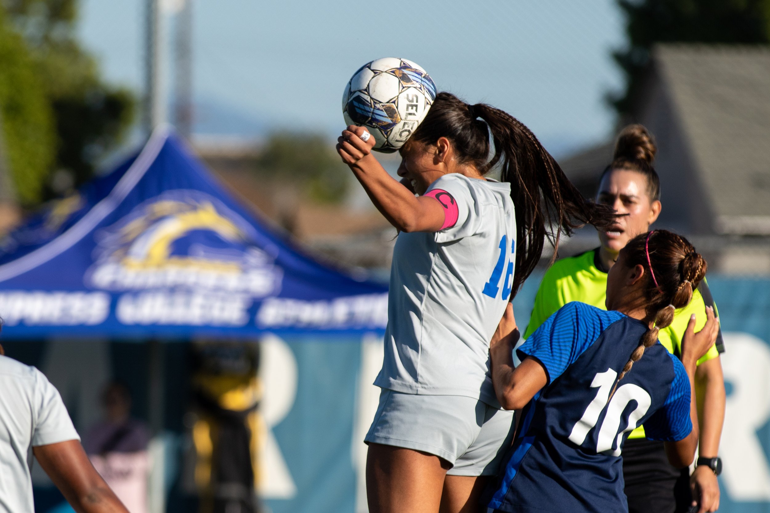  Santa Monica Corsairs' defender Bella Velazco (16) heads the ball in front of fwd/mid Itzel Ramirez (10) during the women's soccer match on Saturday, Nov. 25, 2023 at Cypress College in Cypress, Calif.  (Akemi Rico | The Corsair) 