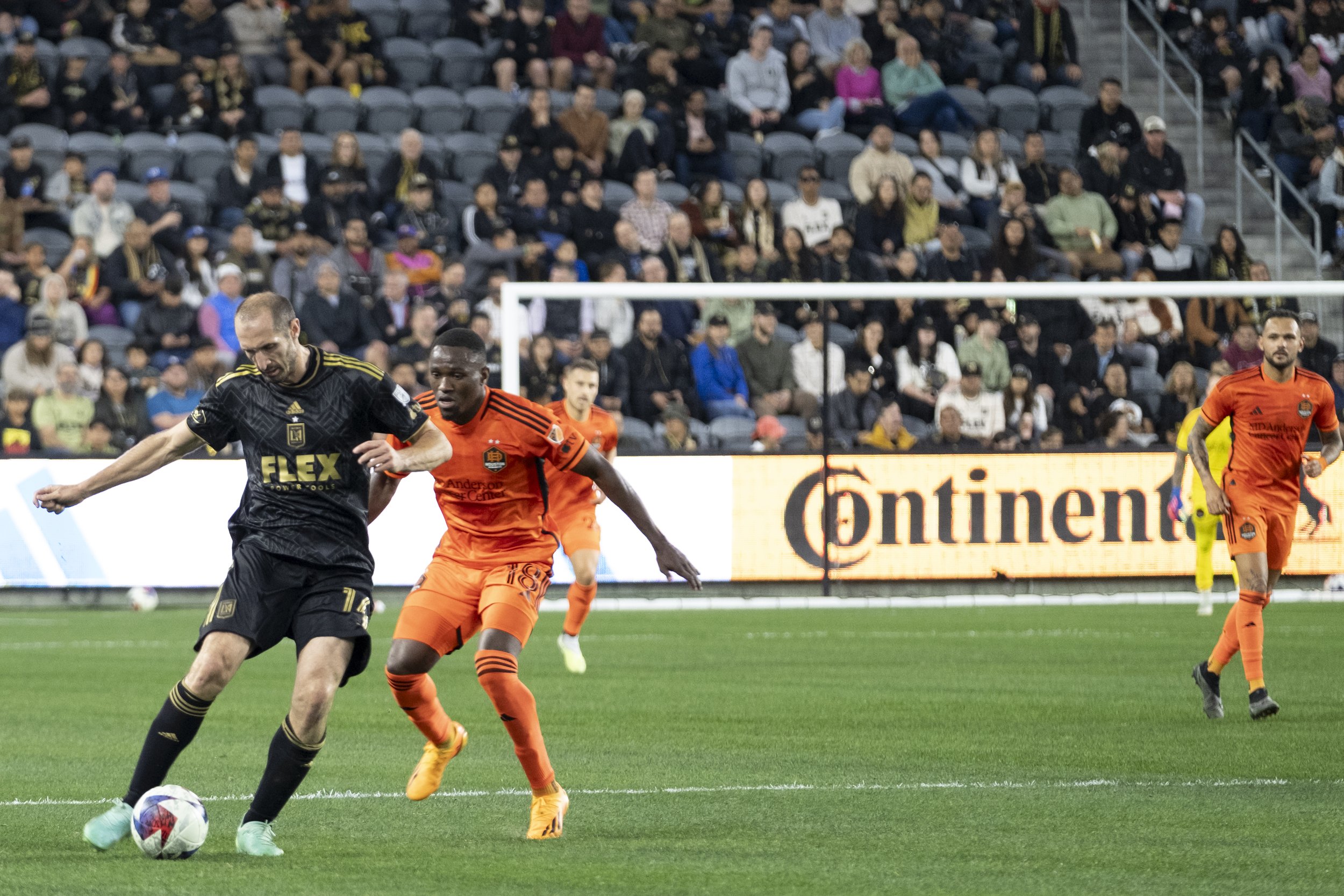  Giorgio Chiellini, Defender #14 of LAFC, kicks the ball away as Houston Dynamo Forward Aliyu Ibrahim #18,  Major League Soccer (MLS) match on Wednesday, June 14, at the Bank of Montreal (BMO) Stadium in Los Angeles, California. (Anna Sophia Moltke |