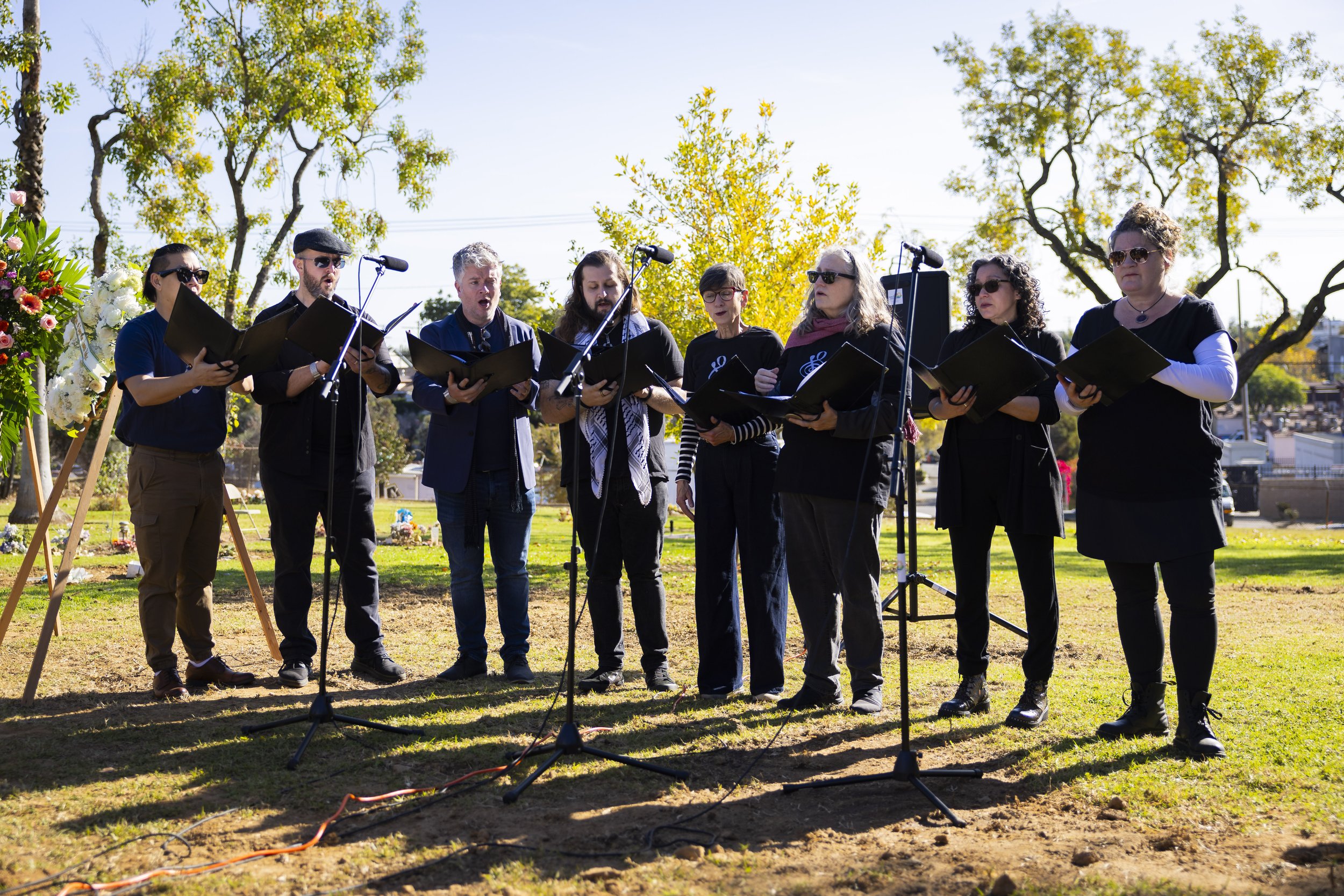  The Street Symphony sings during the Los Angeles County Ceremony of the Unclaimed Dead at the LA County Cemetery, in Los Angeles, Calif., on Thursday, Dec. 14, 2023. The ceremony honored 1,937 individuals who died in 2020 and either did not have nex