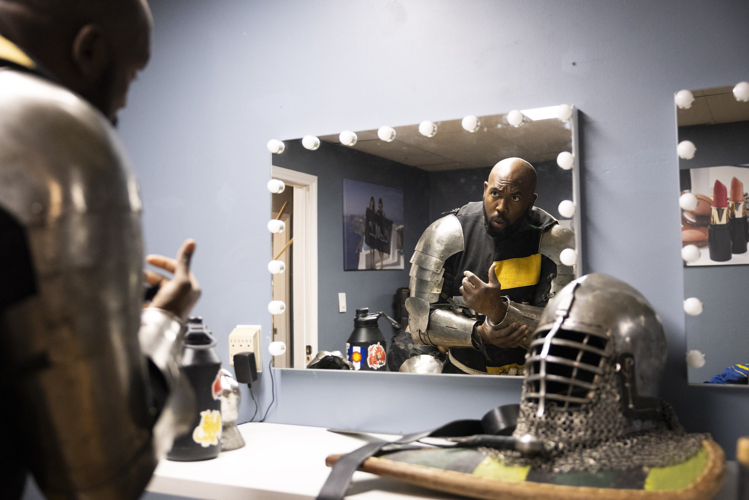  Spencer “Seto” Waddell, a buhurt fighter who is fifth overall in the world in longsword duels, looks in the mirror before Golden Ring II begins in Burbank, Calif., on Saturday, Dec. 16, 2023. Waddell ending up losing to William “Bam Bam” Woodbury, w