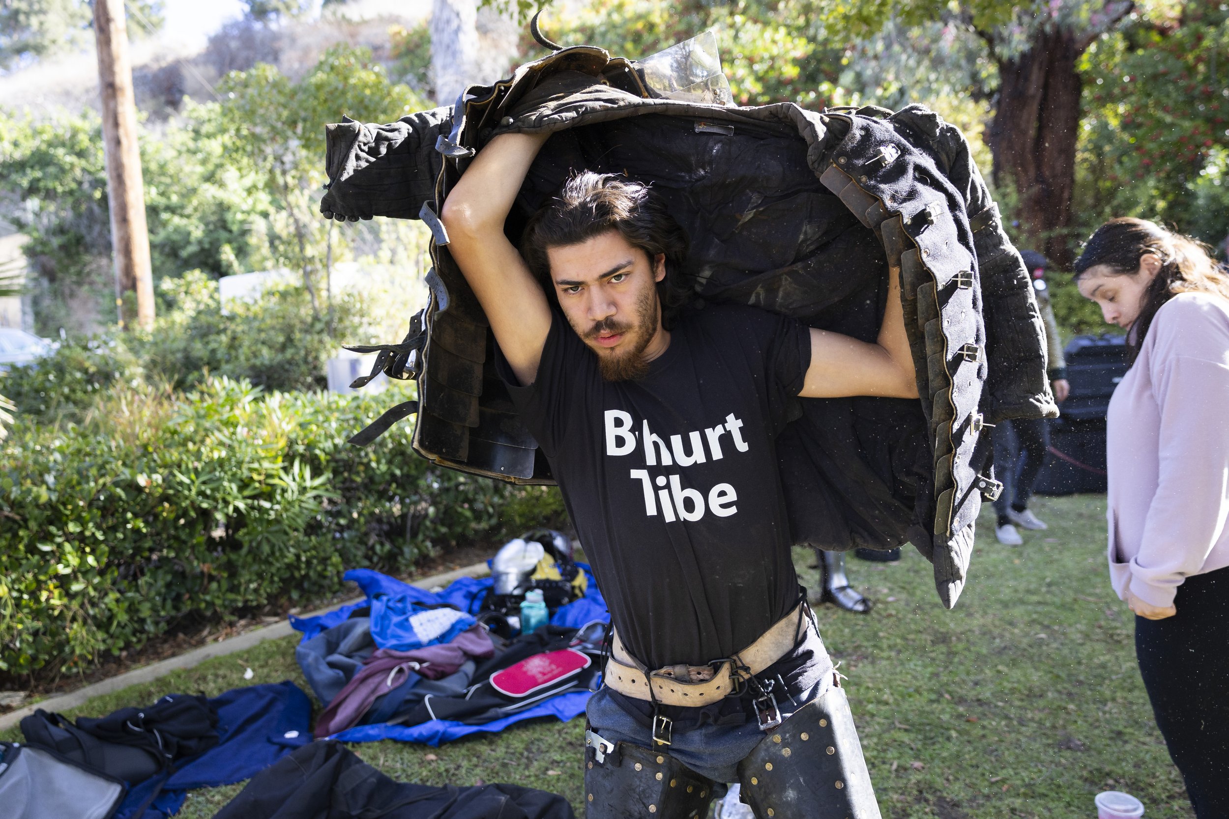  Angel Jauregui, a member of the buhurt team Los Angeles Golden Knights, puts on his brigandine during a weekend practice at Culver City Park in Culver City, Calif., on Saturday, Dec. 9, 2023. Brigandine is a thick cloth armor with steel sewn or rive