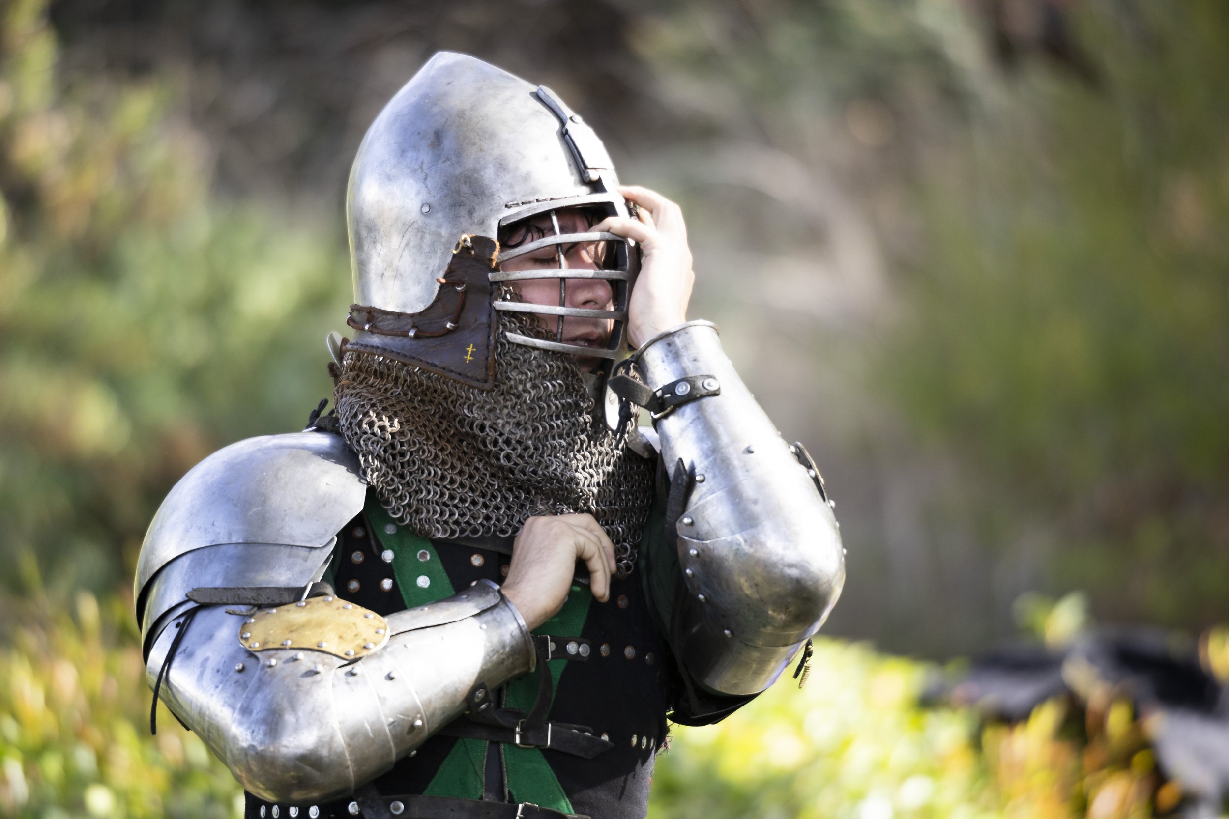  Joe Rodriguez, a member of the buhurt team Los Angeles Golden Knights, adjusts his helmet during team practice at Culver City Park in Culver City, Calif., on Saturday, Dec. 9, 2023. Buhurt, otherwise known as armored combat, is a full contact fighti