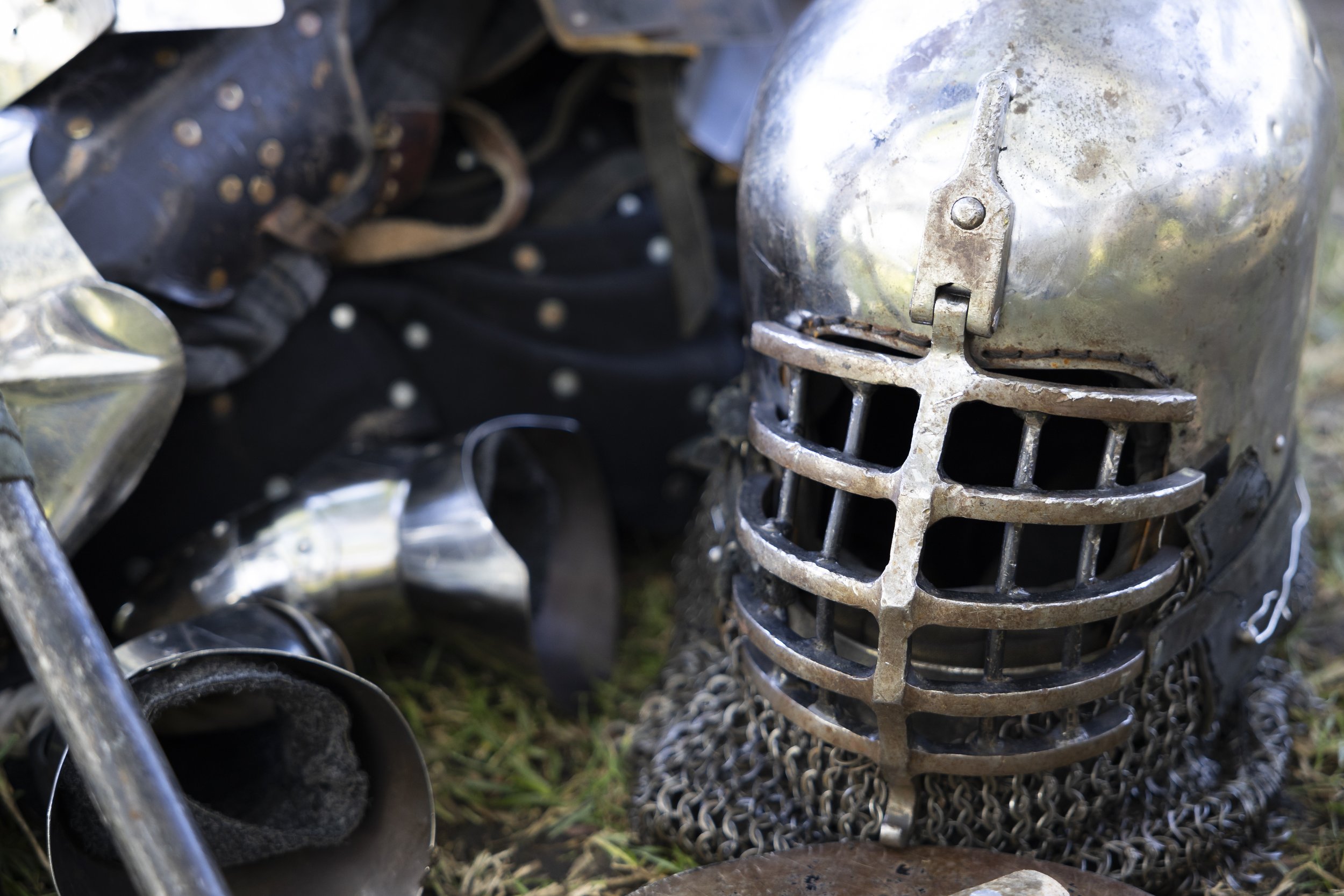  A helmet and other gear commonly used in buhurt rest on the ground during a Los Angeles Golden Knights team practice at Culver City Park in Culver City, Calif., on Saturday, Dec. 9, 2023. Buhurt, otherwise known as armored combat, is a full contact 