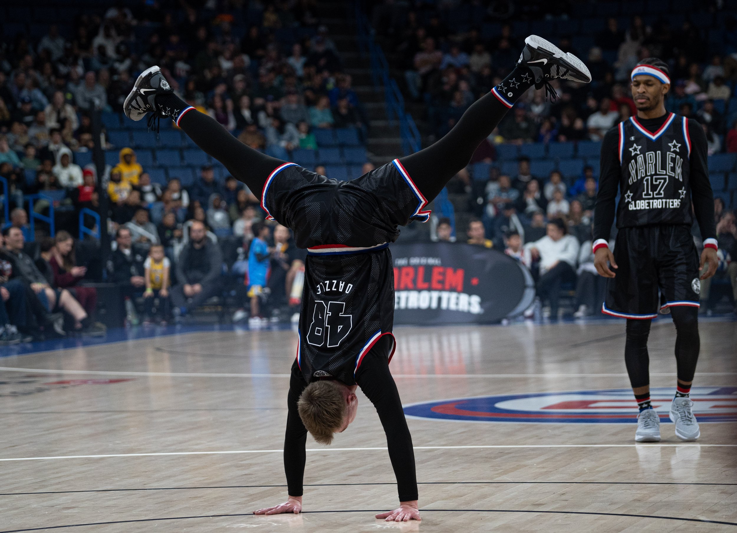  Dazzle Kidon standing on his hands after the Harlem Globetrotters were introduced at Toyota Arena in Ontario, Calif. Globetrotters were facing the Washington Generals on Monday, Feb.19, 2024. (Danilo Perez | The Corsair) 