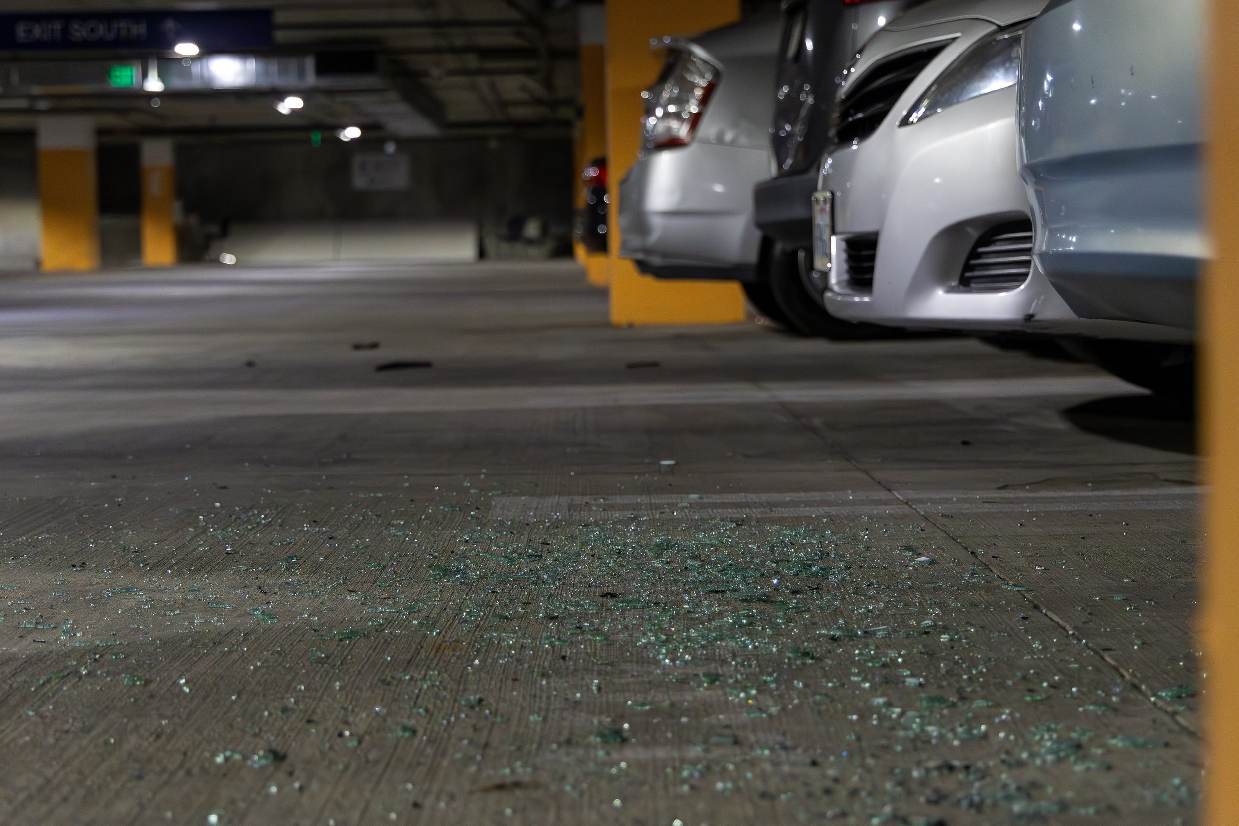  Shattered glass on the floor of the Level P3 of the underground parking of Santa Monica College (SMC) Student Services building, Santa Monica, Calif., on Feb. 28, 2024. According to Mr. Olivera Santos (Grounds services of SMC), between 20-25 cars we