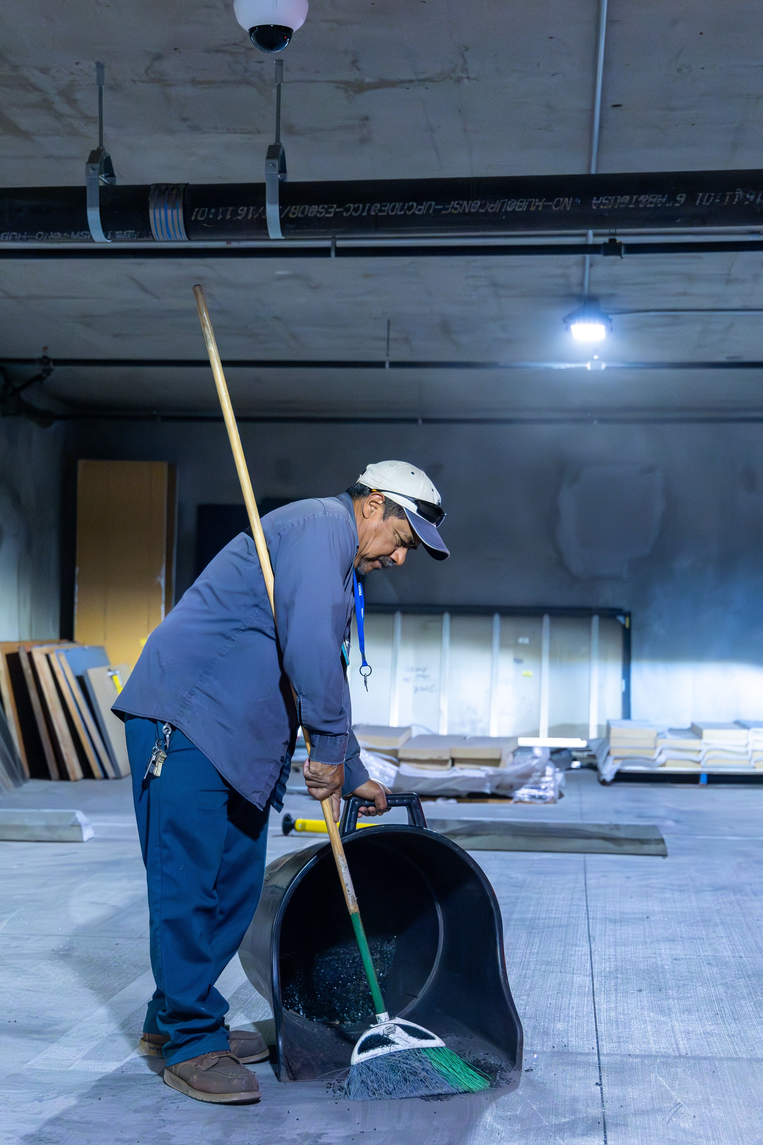  Armando Olivera Santos, team member of the Grounds services of Santa Monica College (SMC) clears up the broken glass on the Level P3 of the underground parking of SMC Student Services building, Santa Monica, Calif., on Feb. 28, 2024. According to Mr