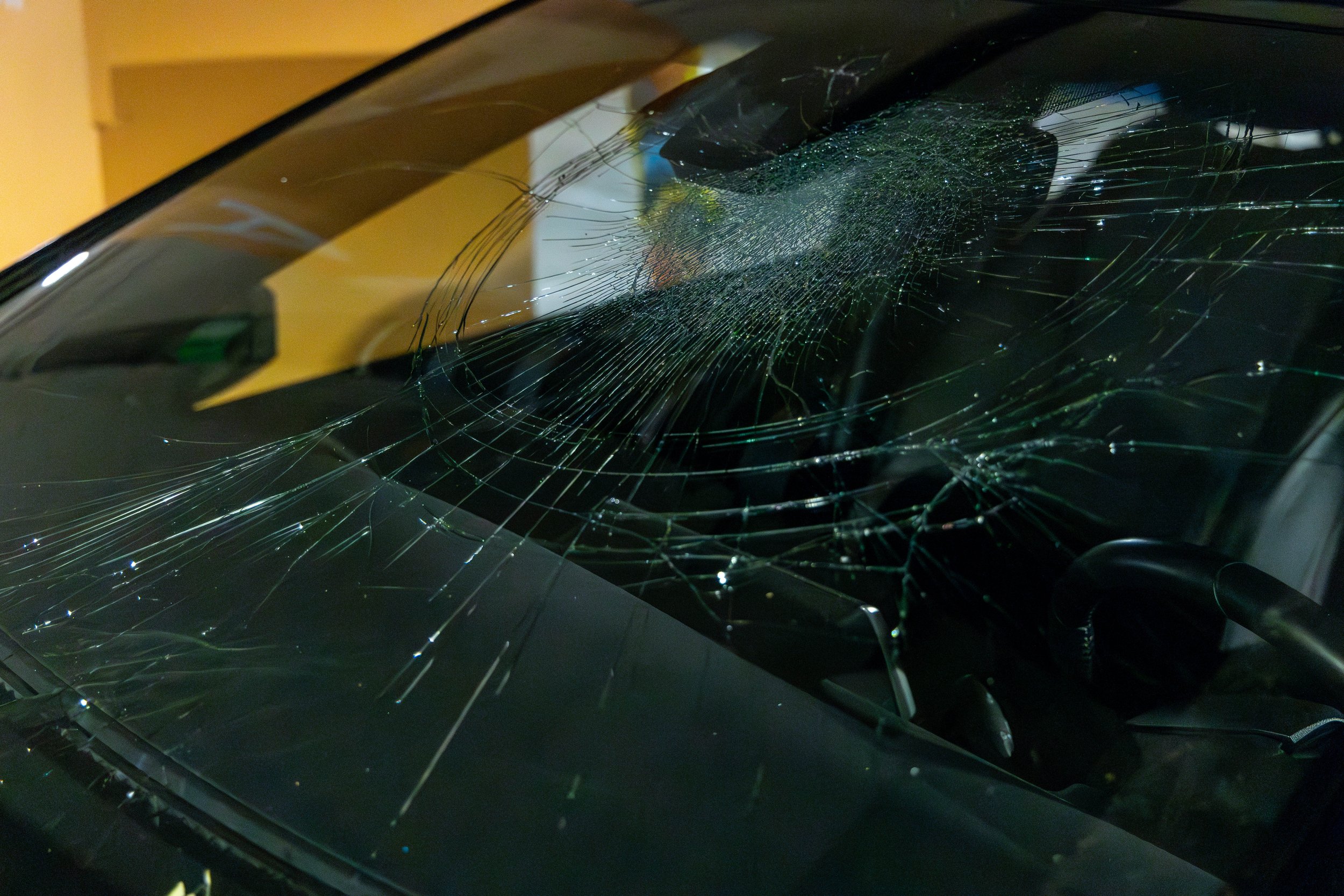  Shattered windshield of one of the cars that were vandalized on the Level P3 of the underground parking of Santa Monica College (SMC) Student Services building, Santa Monica, Calif., on Feb. 28, 2024. According to Mr. Olivera Santos (Grounds service