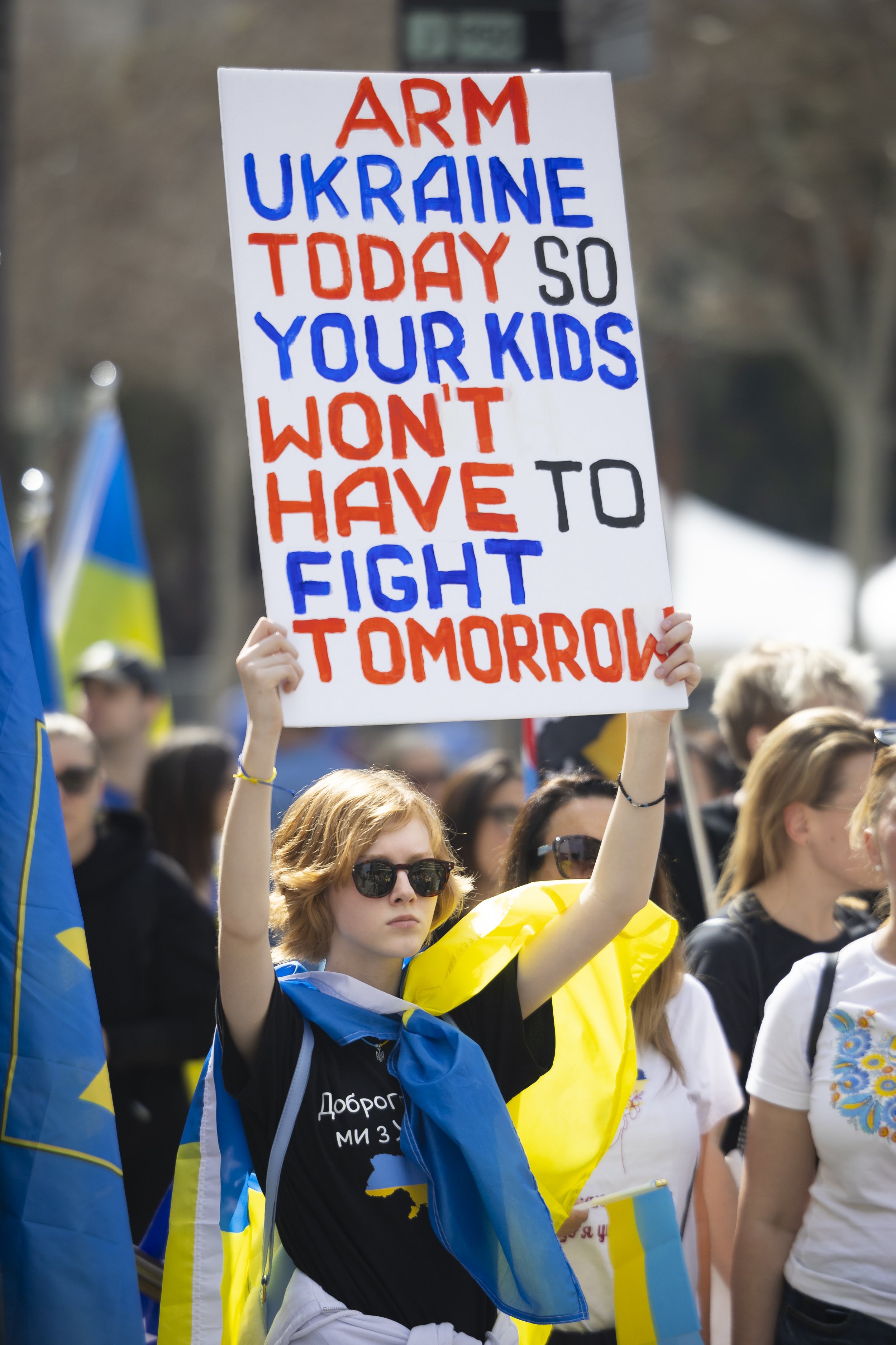  A protester holds a sign which reads “Arm Ukraine Today So Your Kids Won’t Have to Fight Tomorrow” during a protest organized by Stand With Ukriane Foundation outside Los Angeles City Hall, Los Angeles, Calif., on Saturday, Feb. 24, 2024. The protes