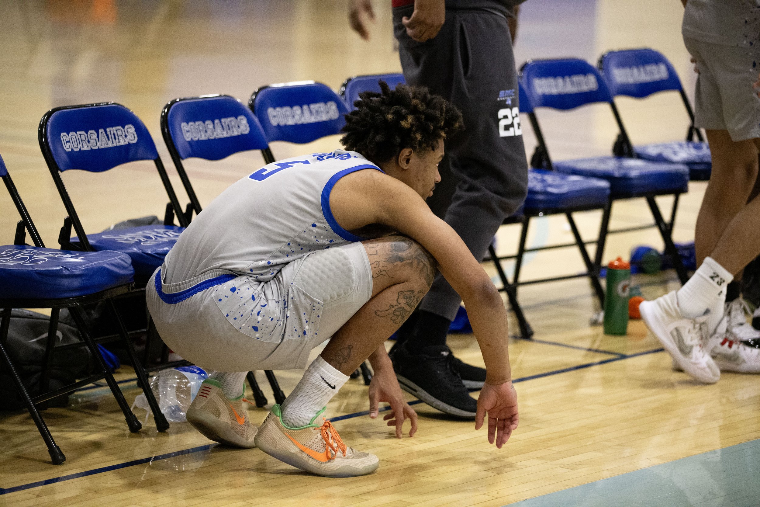  Santa Monica College(SMC) Corsair power forward Elijah Scranton squats down as Saddleback College is awarded free throws within the last minutes in the game on Wednesday, Feb. 28, 2024. Corsairs fall short against the Bobcats with a final score of 7