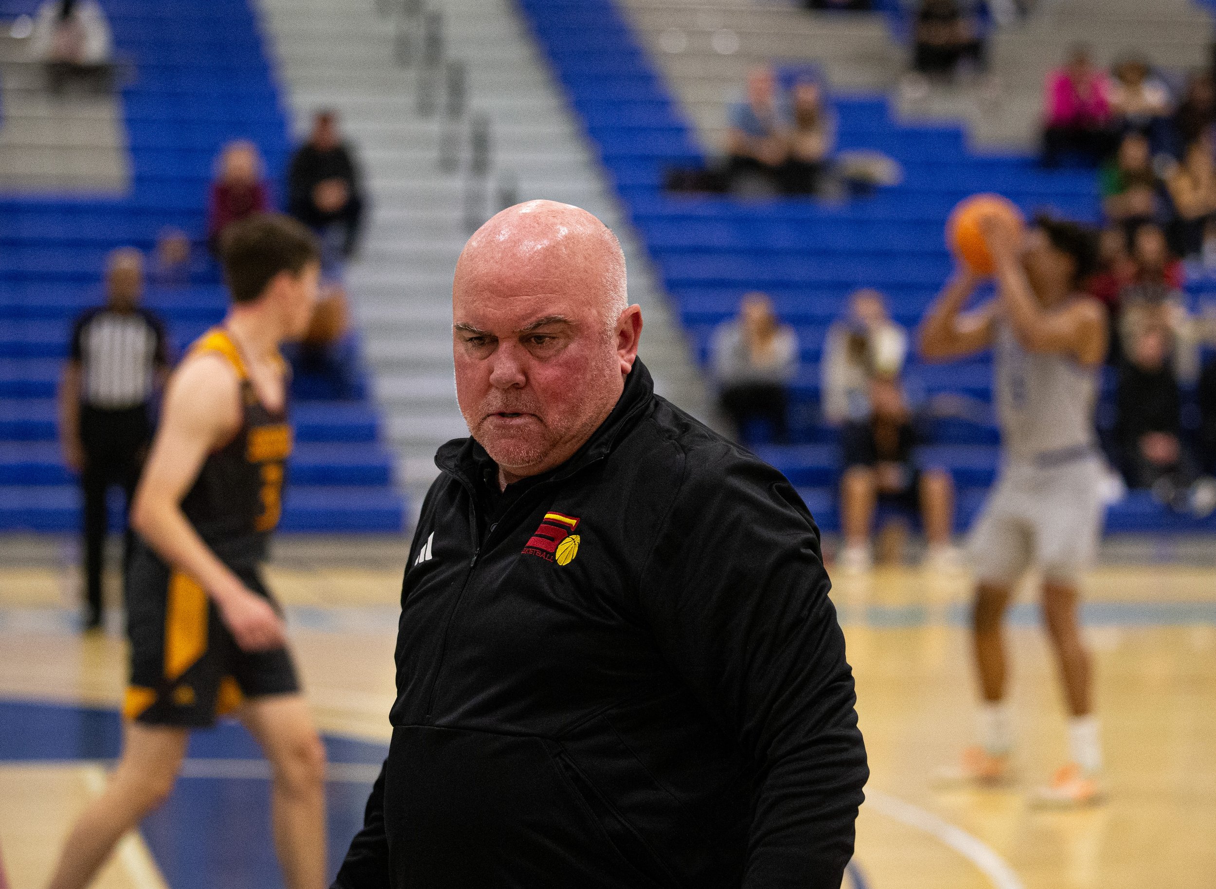  Saddleback College Bobcat mens basketball head coach Jeff Oliver turns away while Santa Monica College(SMC) Corsair Elijah Scranton goes for the three pointer on Wednesday, Feb. 28, 2024. Bobcats take home the playoff win 75-73 at SMC Pavillion in S