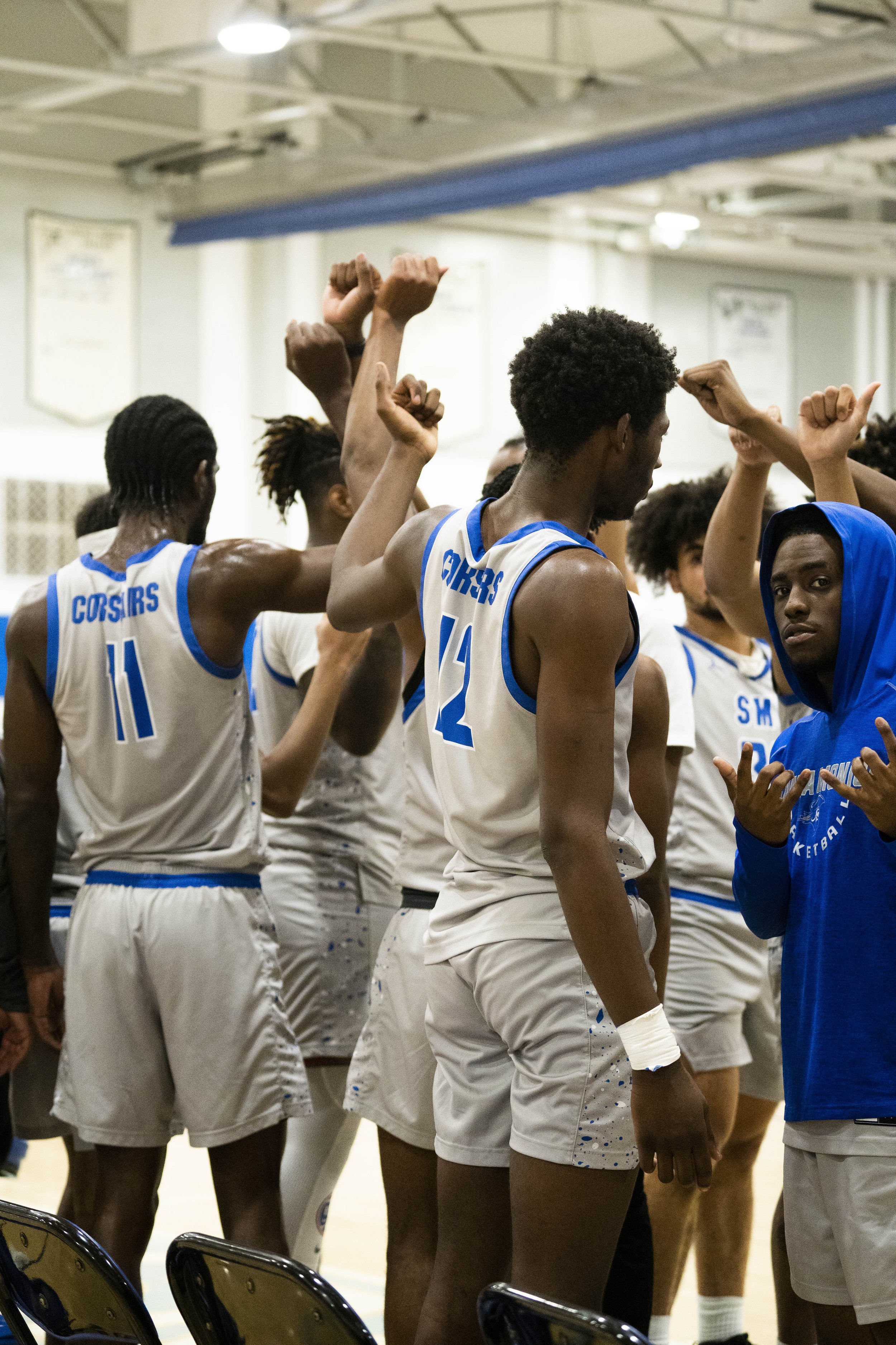  Santa Monica College Corsair Basketball teamates all raise their hands in huddle after a timeout at SMC Pavillion in Santa Monica, Calif., on Wednesday, Feb. 28,2024 (Corsair Photo:Jamael Shotomide) 