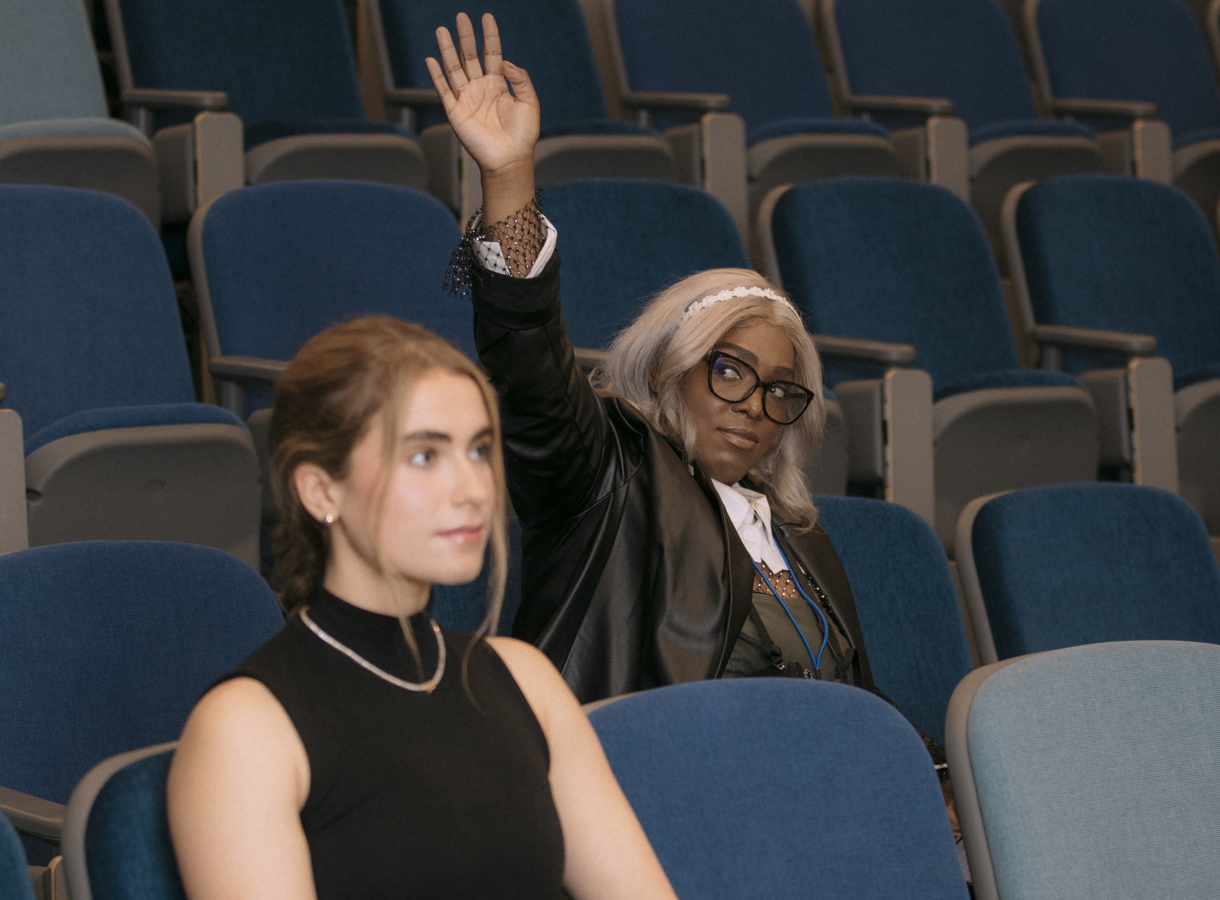  Brianna Johnson raises her hand to ask a question to a candidate at the Santa Monica College student government election event. Santa Monica, Calif., on March 30th, 2024.  (Corsair Photo: Luca Martinez) 