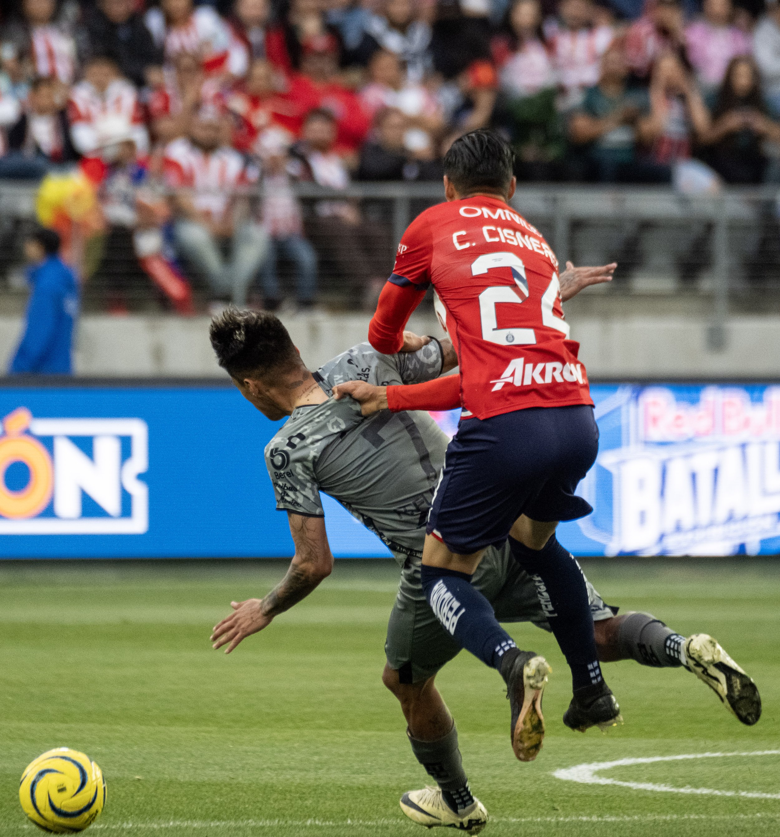  Atlas F.C. forward Raymundo Fulgencio(7) gets fouled by Chivas midfielder Carlos Cisneros(24) in their derby on Sunday, March 24 at BMO Stadium in Los Angeles, Calif. (Danilo Perez | The Corsair) 