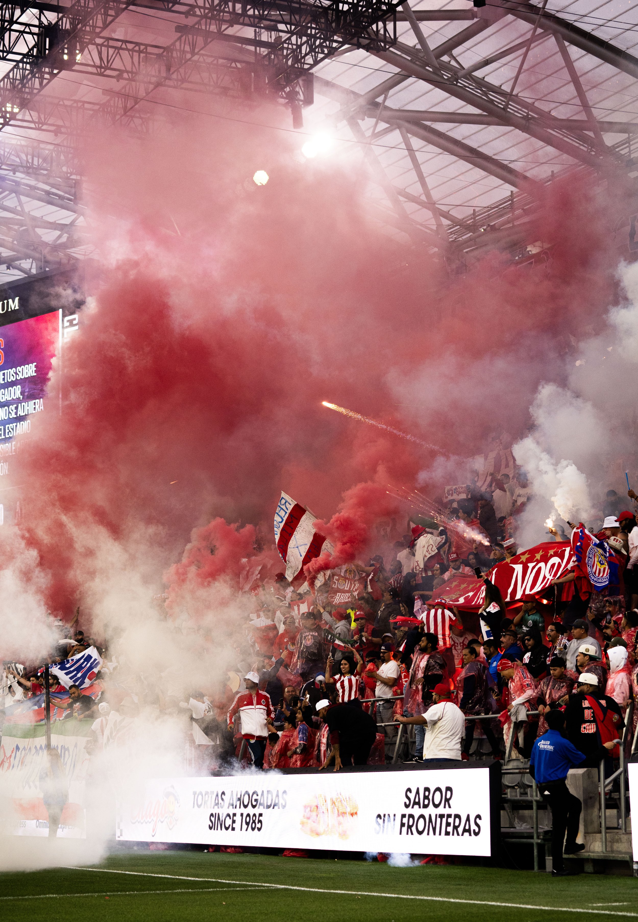  Chiva fans shoot Roman Candles and pop open smoke canisters before the end of the Chiva-Atlas game that ended in a scoreless tie on Sunday, March 24 in BMO Stadium at Los Angeles, Calif. (Danilo Perez | The Corsair) 