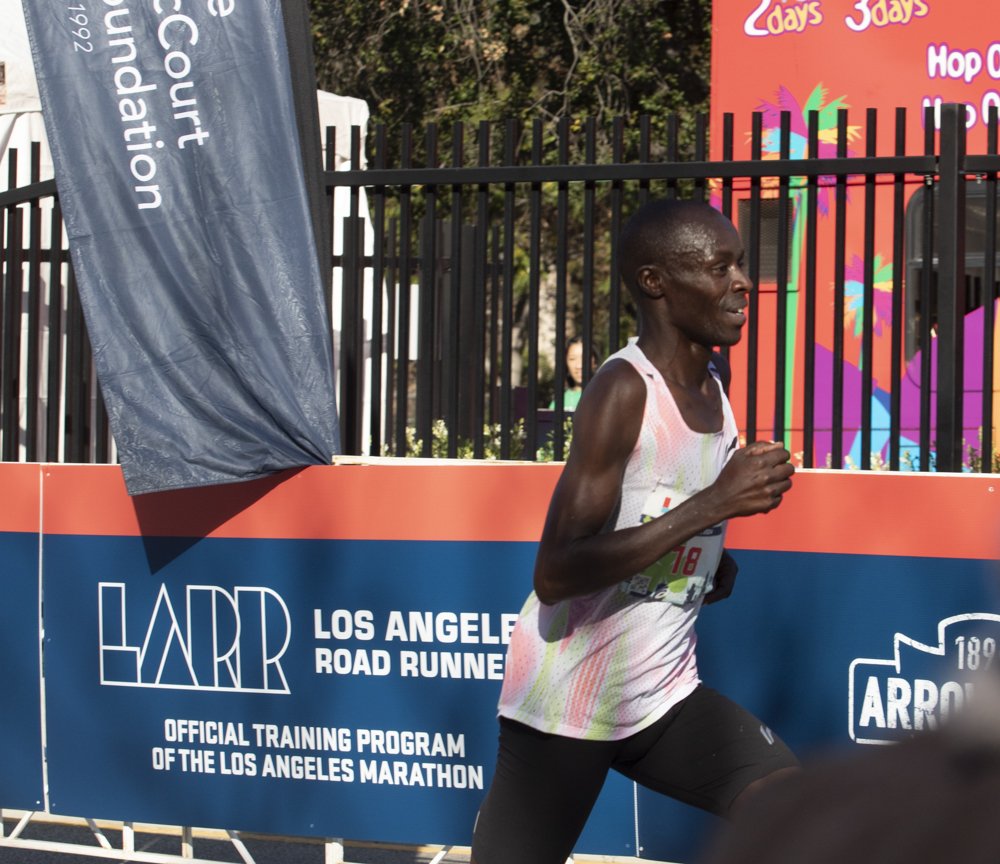 Cosmas Kiplimo from Kenya moments befroe he crosses the finish line in second place at the Los Angeles Marathon, Sunday March 17, 2024, Beverly Hills, Los Angeles, Calif. 