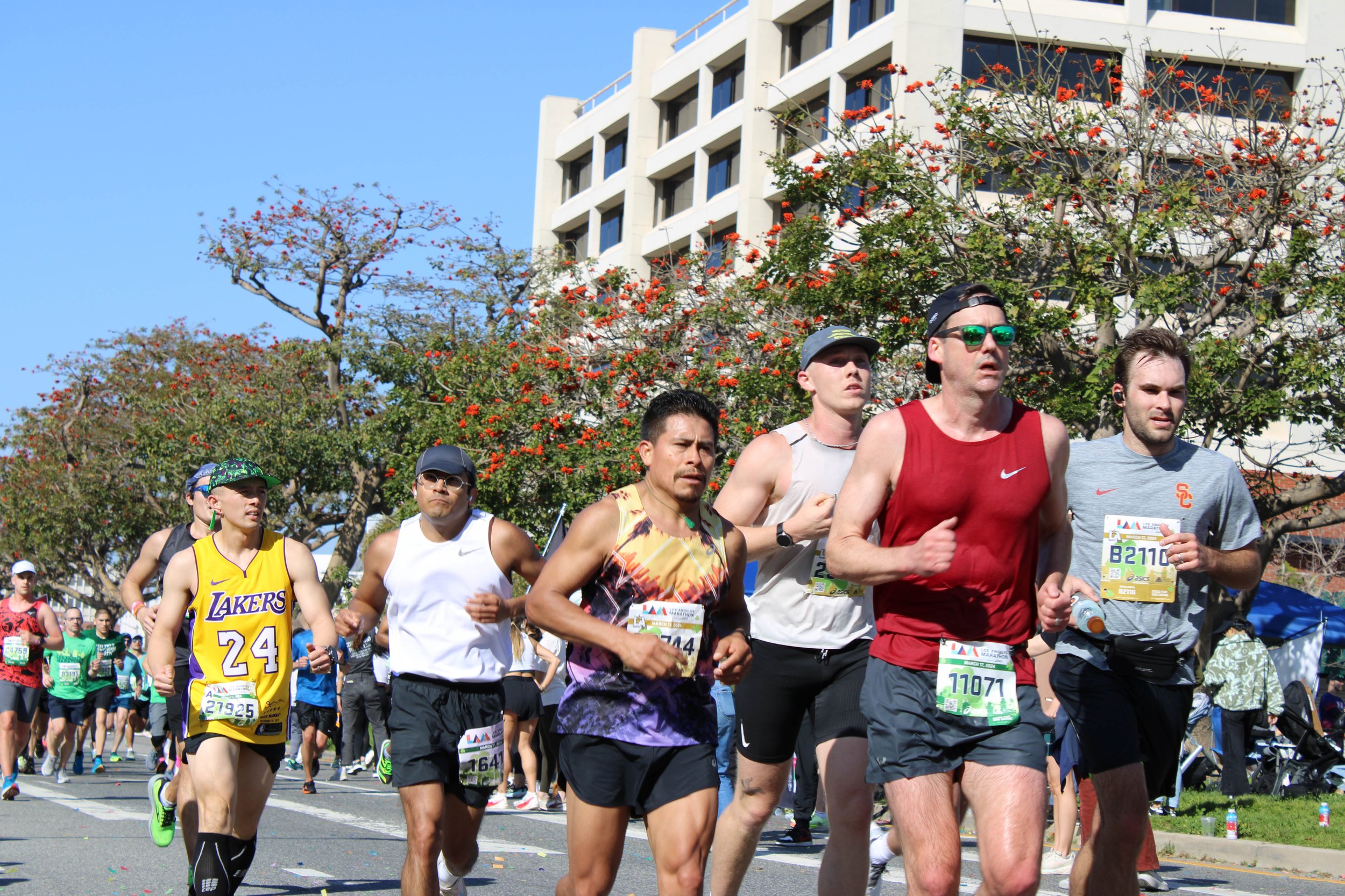  Runners (Julian Carson - right) (Carlo Batungbacal - left) make homestretch on Sunset Boulevard as Los Angeles Marathon nears end 