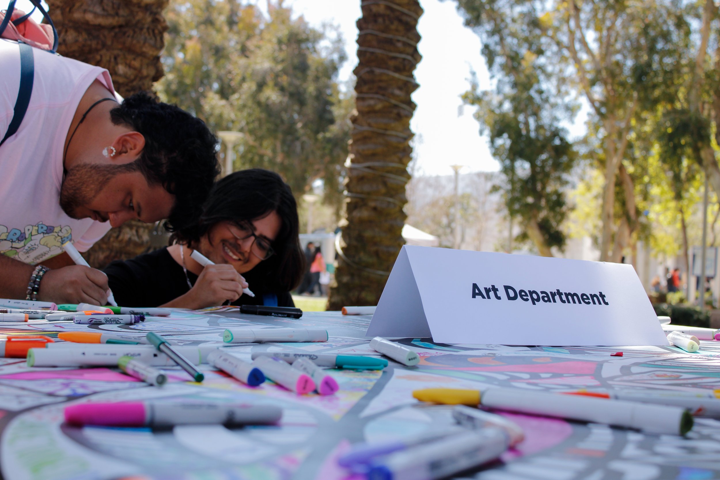  Bryan Lara and Ervin Alexander Escalante coloring at SMC's Midterm Motivation event on April 3.  