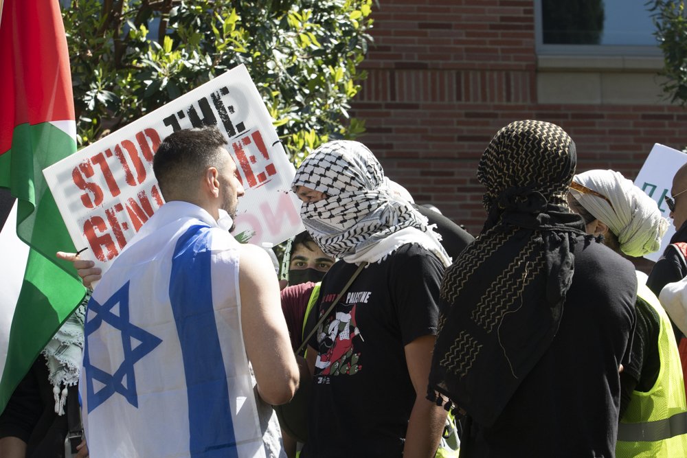  Pro-Israeli demonstrator being pushed out of  the Pro-Palestine rally by Pro-Palestine demonstrators Sunday, April 28, 2024 University of California Los Angeles, UCLA, Los Angeles, Calif. ( Laurel Rahn | The Corsair ) 