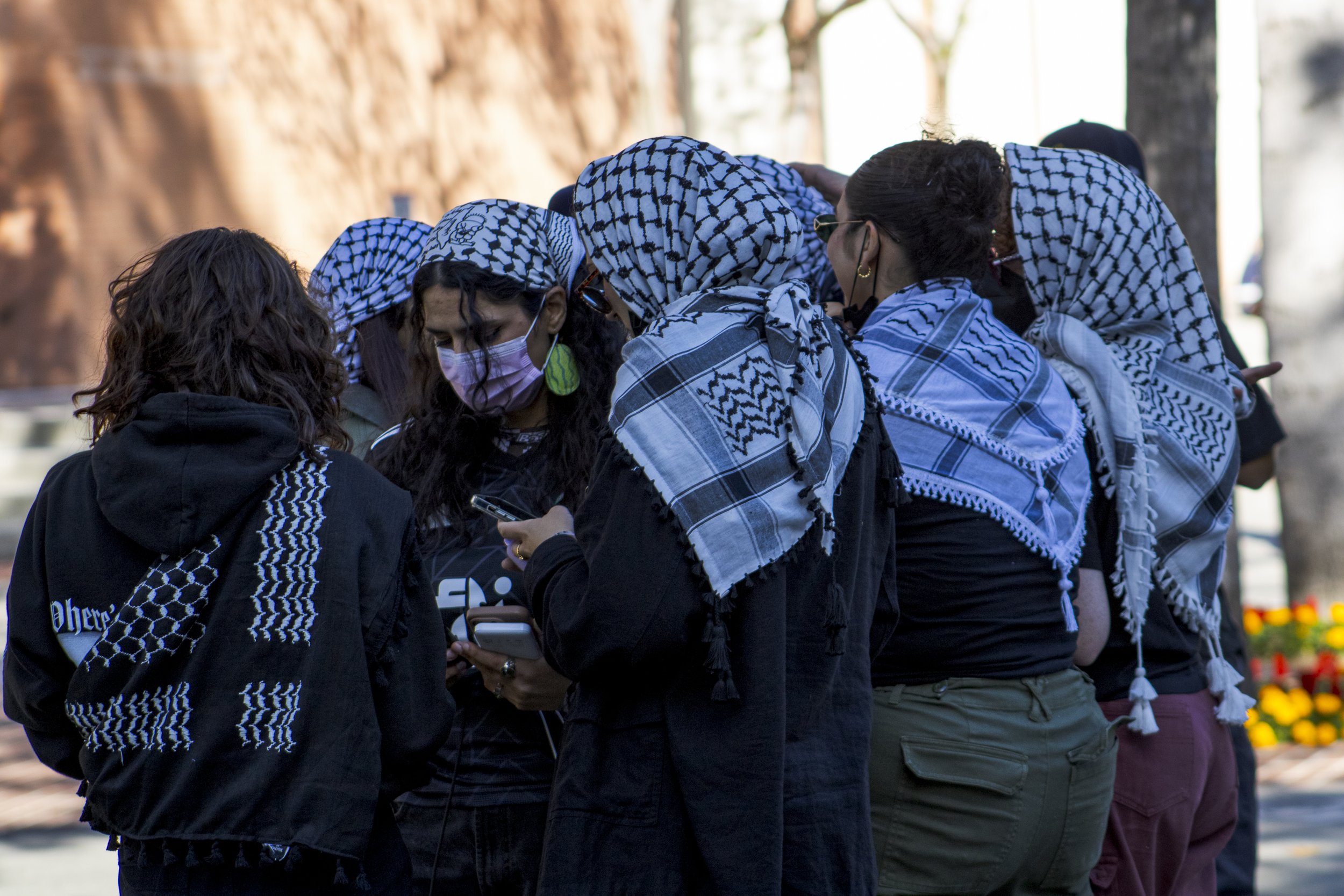  Members of the Divest from Death University of Southern California activist group wear matching Keffiyeh, a Middle Eastern headdress to protect their identities. Protesters have occupied, the EF Hutton Park on USC campus in Los Angeles California, o