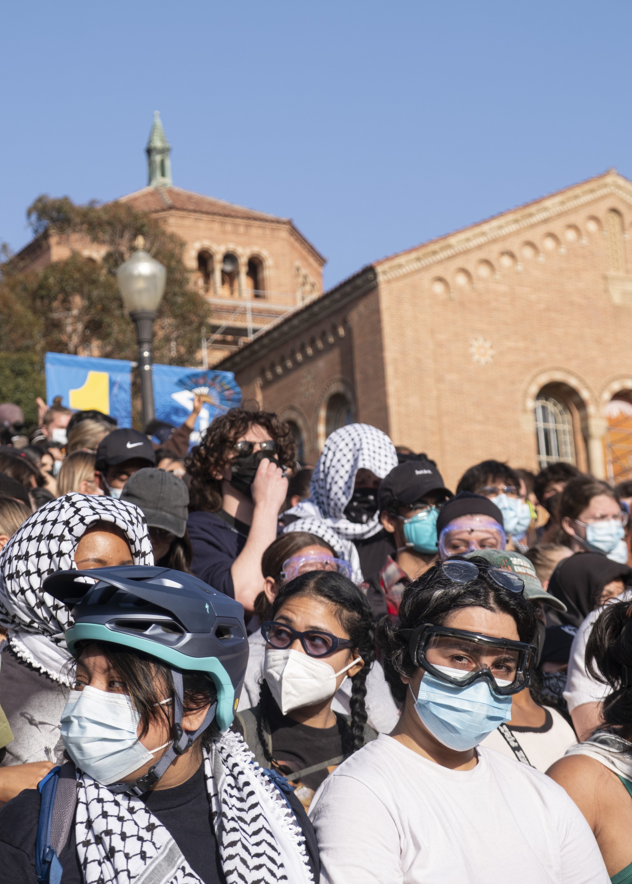  Pro-Palastinian supporters wear goggles and mask in preperation of tear gas as they stand together to defend the University of California, Los Angeles(UCLA) encampment on Wednesday, May 1 at Los Angeles, Calif. Dozens of protesters came out to Dicks