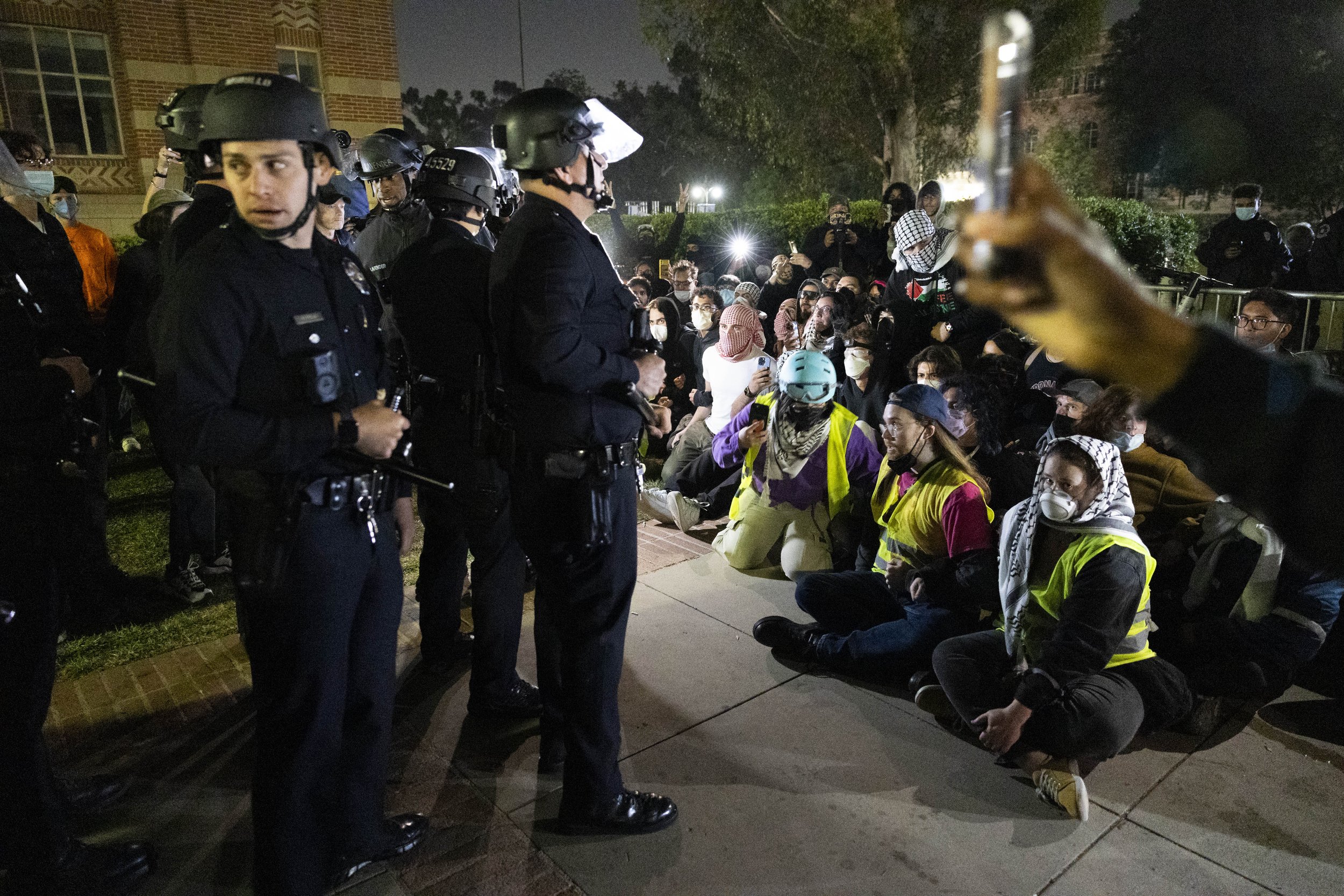  Los Angeles Police Department officers and protesters outside the encampment at University of California, Los Angeles supporting Gaza in the Israeli-Palestine Conflict on in Los Angeles, Calif., on Wednesday, May 1, 2024. The protest was organized t