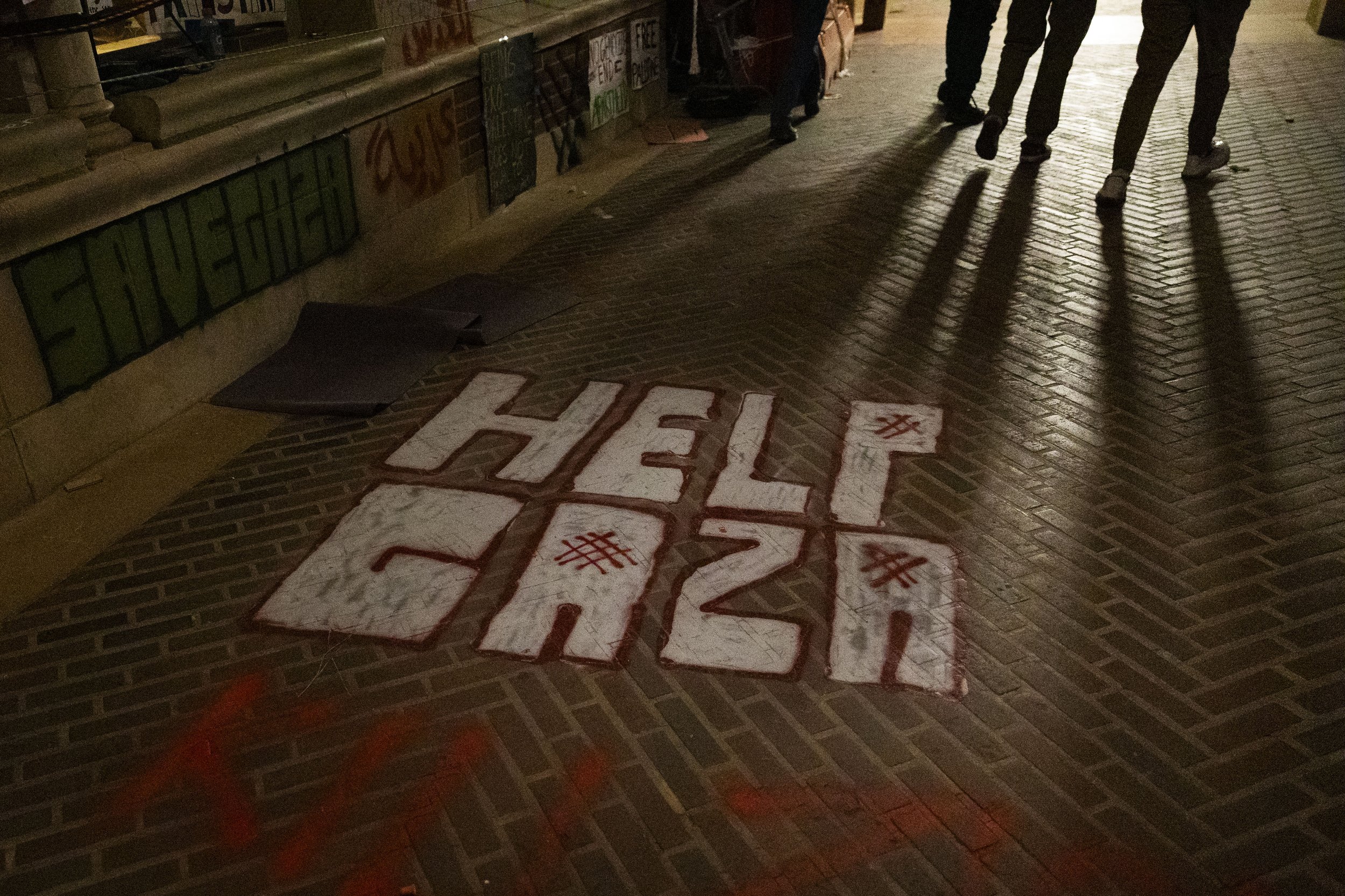  Graffiti which reads “Help Gaza” painted on the path at Royce Hall by protesters in the encampment at the University of California, Los Angeles supporting Gaza in the Israeli-Palestine Conflict in Los Angeles, Calif., on Wednesday, May 1, 2024. Prot