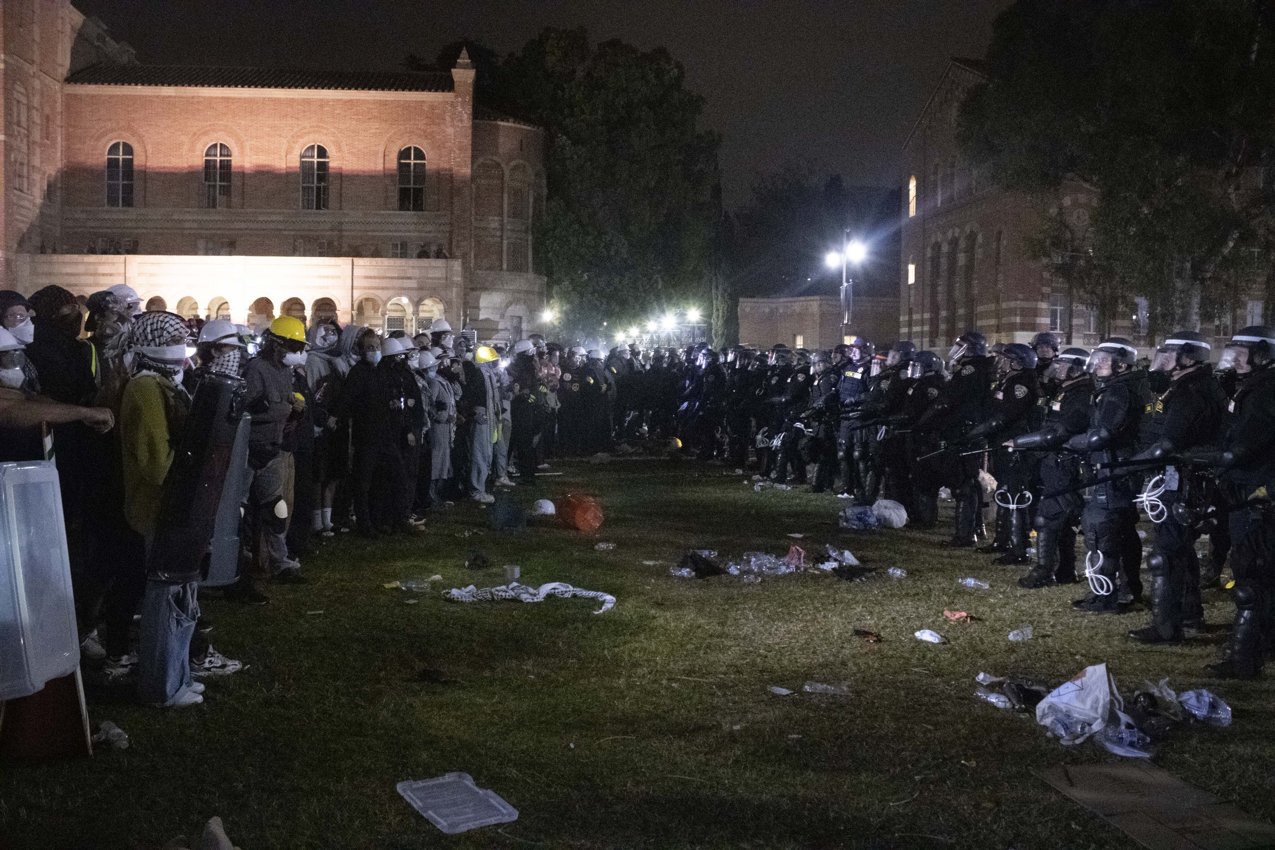  California Highway Patrol (CHP) officers confront protesters after tearing down one of the main barricades to the encampment at University of California, Los Angeles supporting Gaza in the Israeli-Palestine Conflict on in Los Angeles, Calif., on Thu