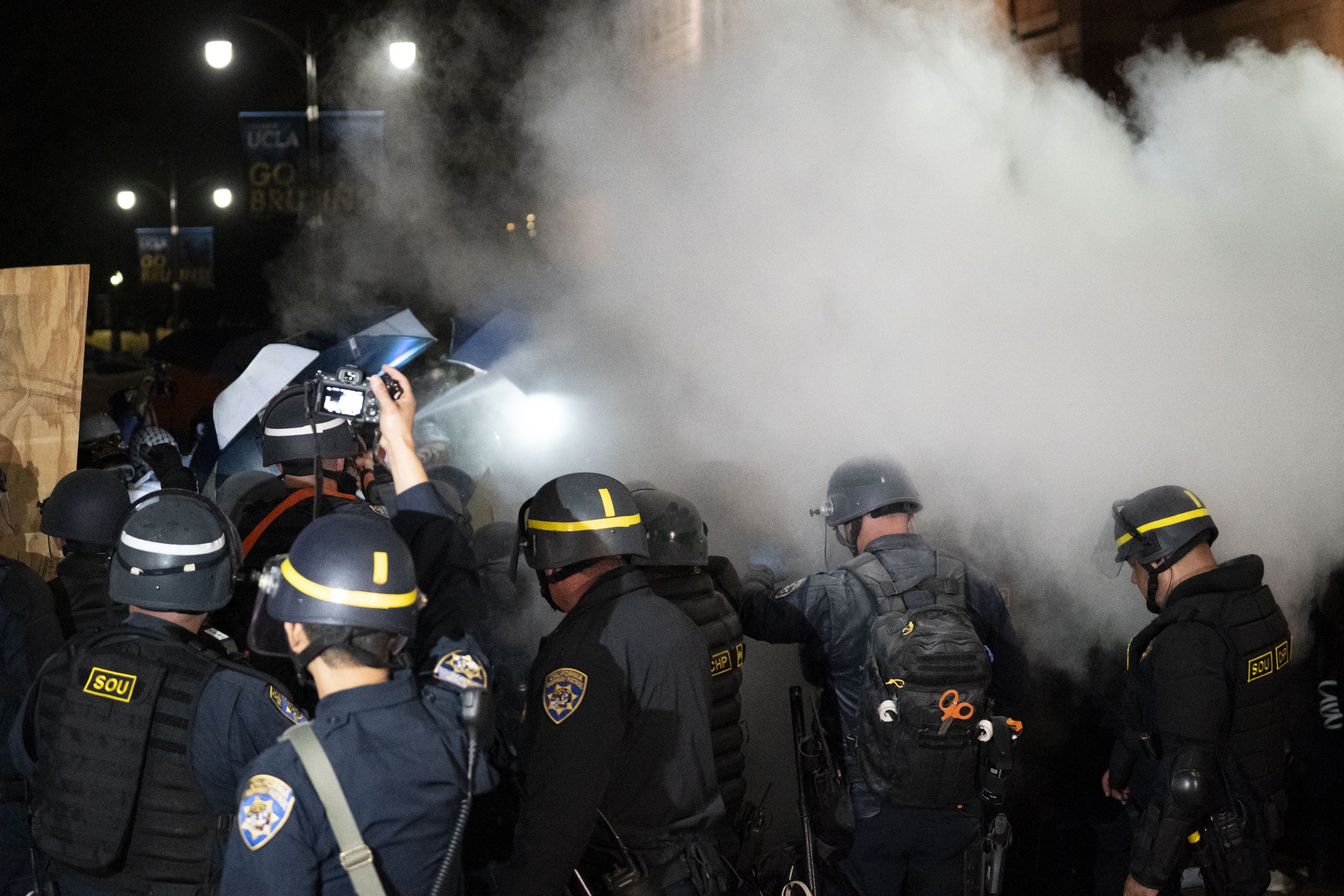  California Highway Patrol Special Operations Unit gets sprayed with dry chemicals from a fire extinguisher by pro-Palastinian protesters within the encampment on Dickson Court of the University of California, Los Angeles on Wednesday, May 1 at Los A