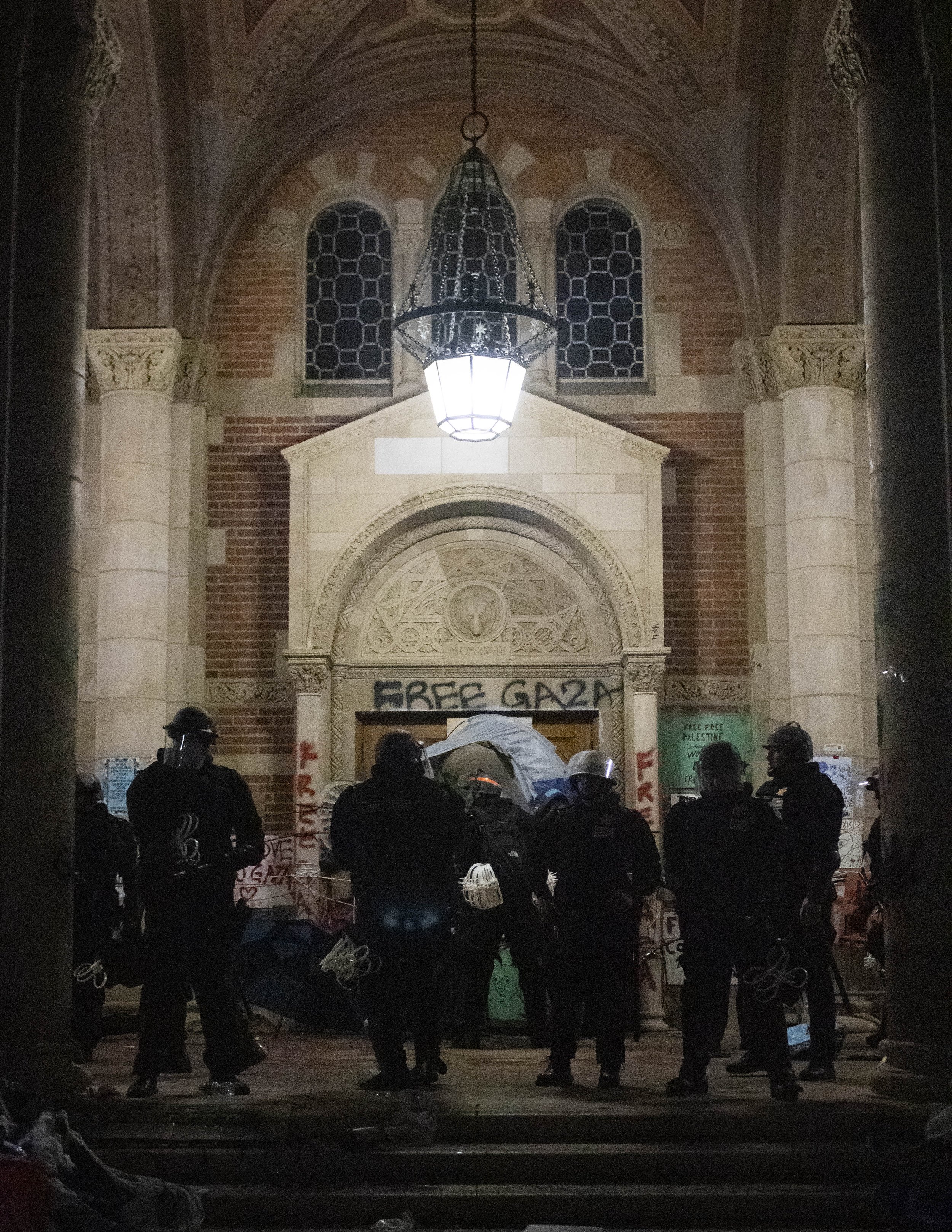  California Highway Patrol (CHP) officers wait on the steps of Royce Hall in the encampment at University of California, Los Angeles supporting Gaza in the Israeli-Palestine Conflict on in Los Angeles, Calif., on Thursday, May 2, 2024. (Caylo Seals |